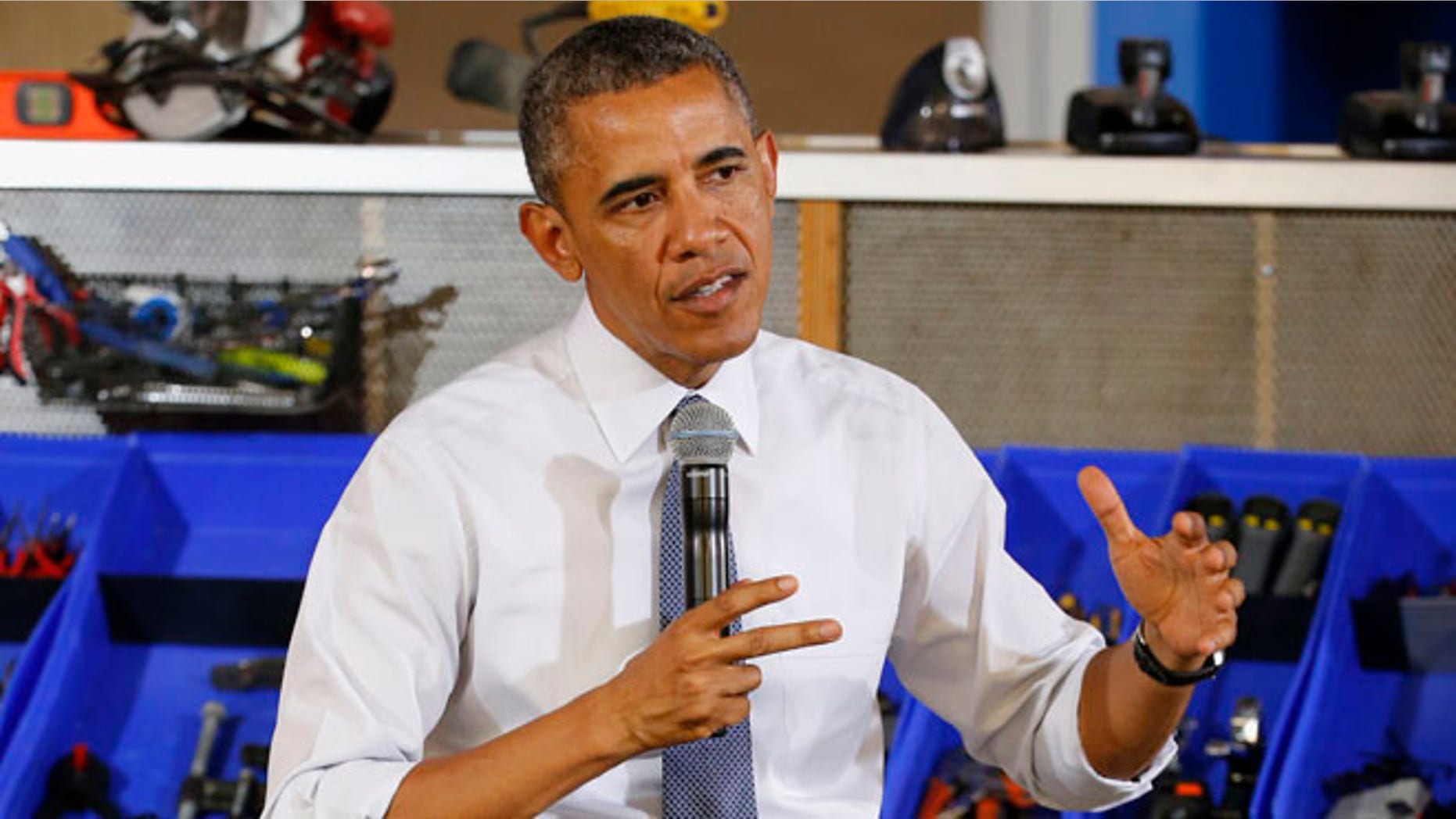 President Barack Obama answers a question Tuesday, June 17, 2014, in Pittsburgh.