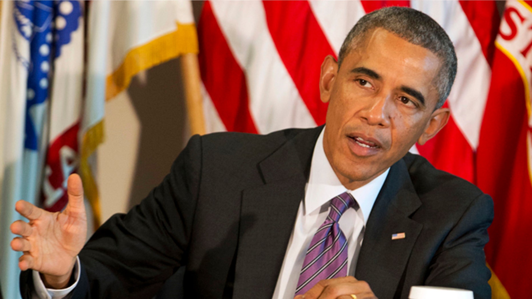 In this Wednesday, Oct. 8, 2014 photo, President Barack Obama speaks during a meeting with senior military leadership at the Pentagon.