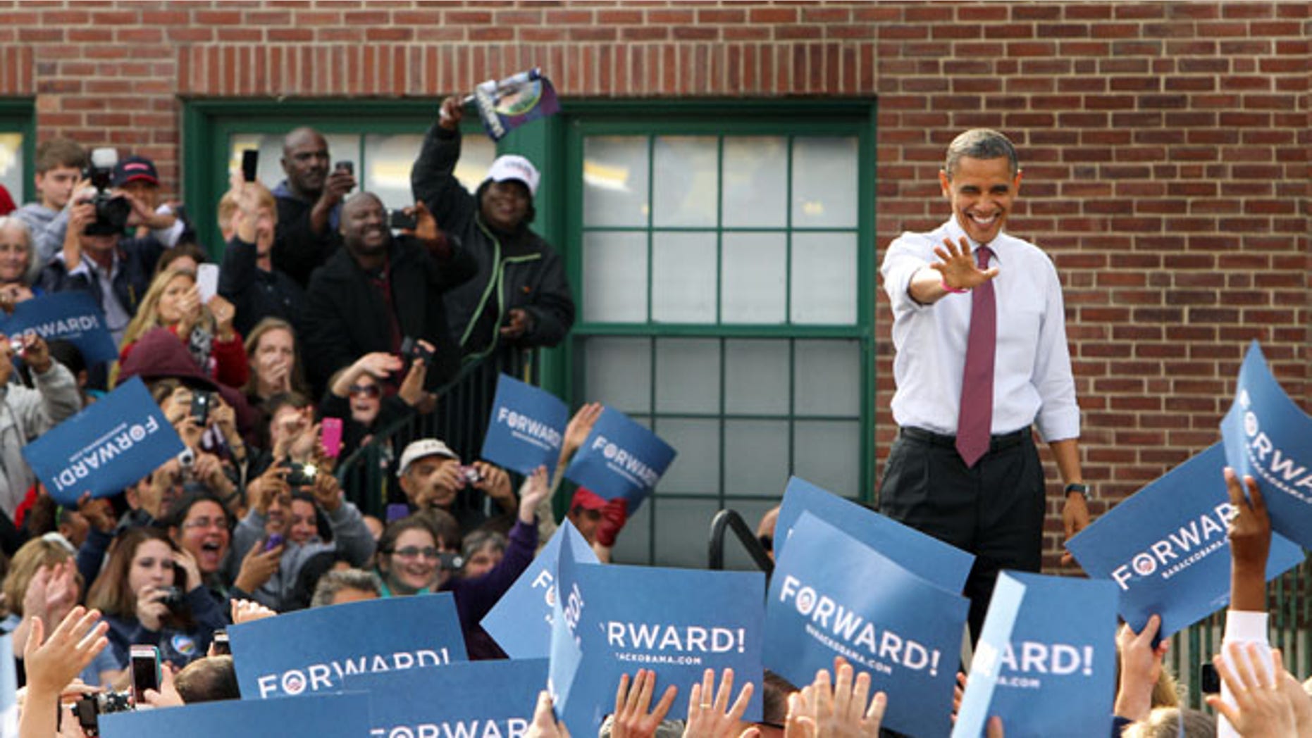 Oct. 27, 2012: President Obama waves to supporters at a campaign event in Nashua, N.H.