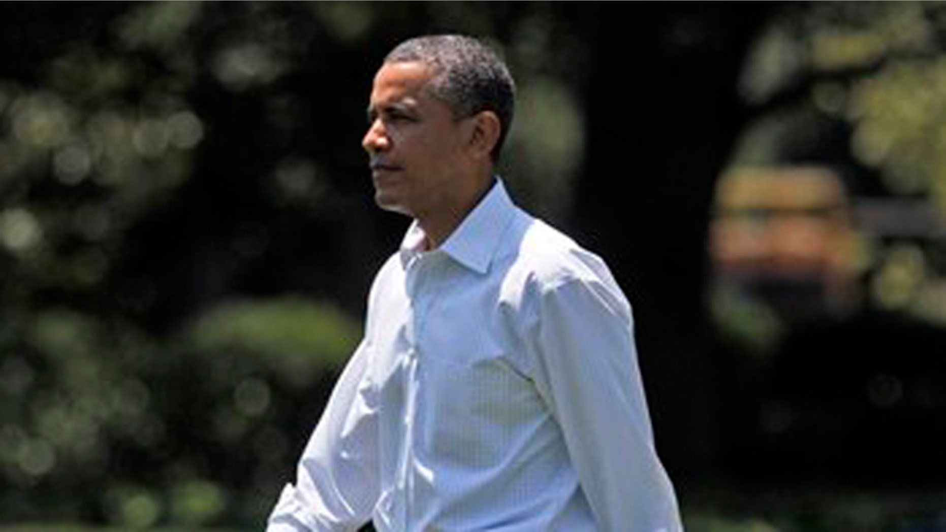 Saturday, June, 30, 2012: President Obama walks across the South Lawn of the White House as he prepares to board Marine One to Camp David, Md.