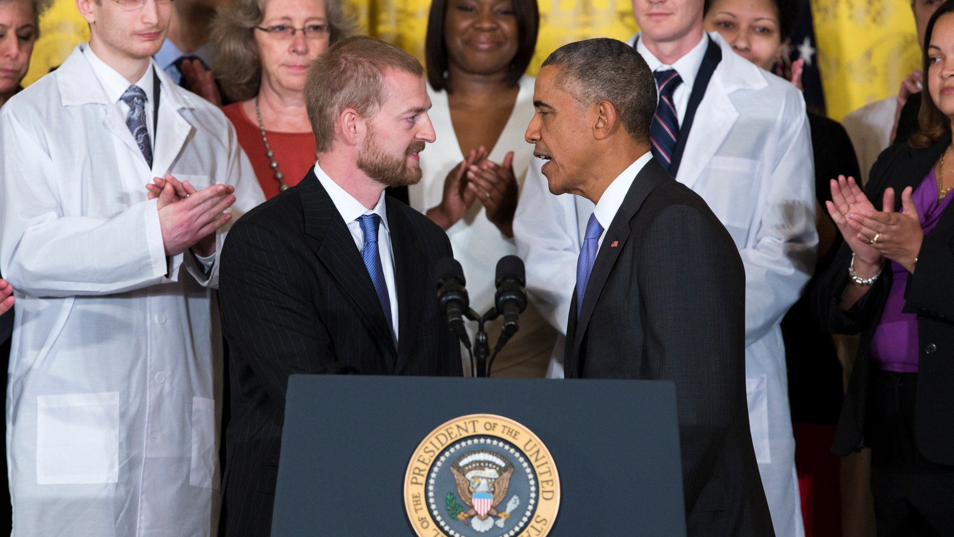 Oct. 29, 2014: President Barack Obama shakes hands with Ebola survivor Dr. Kent Brantly during an event with American health care workers fighting the Ebola virus.