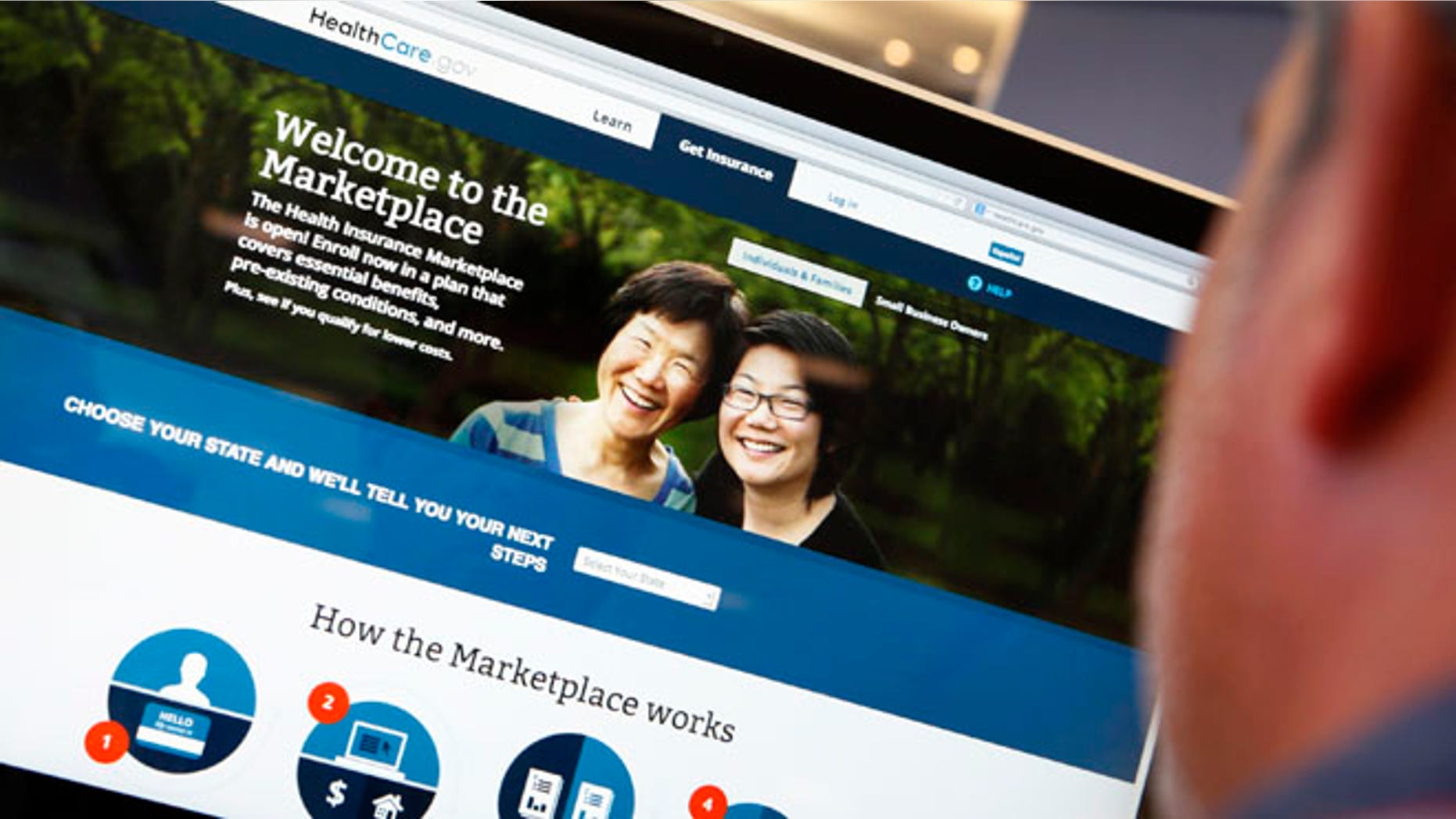 A man looks over ObamaCare signup page on the HealthCare.gov website in New York on October 2, 2013.