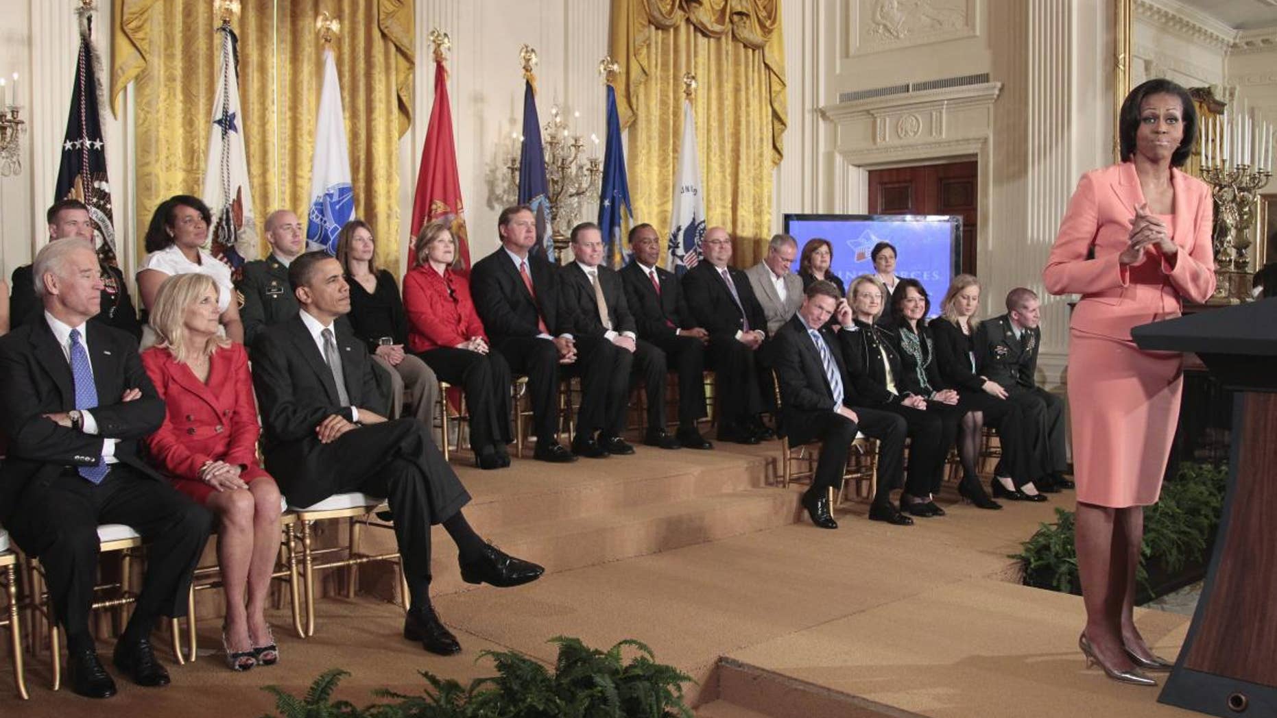 President Barack Obama, Vice President Joe Biden, his wife Jill Biden, and others, listen in the East Room of the White House on Tuesday, April 12, 2011, as first lady Michelle Obama delivers remarks to launch Joining Forces, the national initiative to support and honor America's service members and their families. (AP Photo/Pablo Martinez Monsivais)