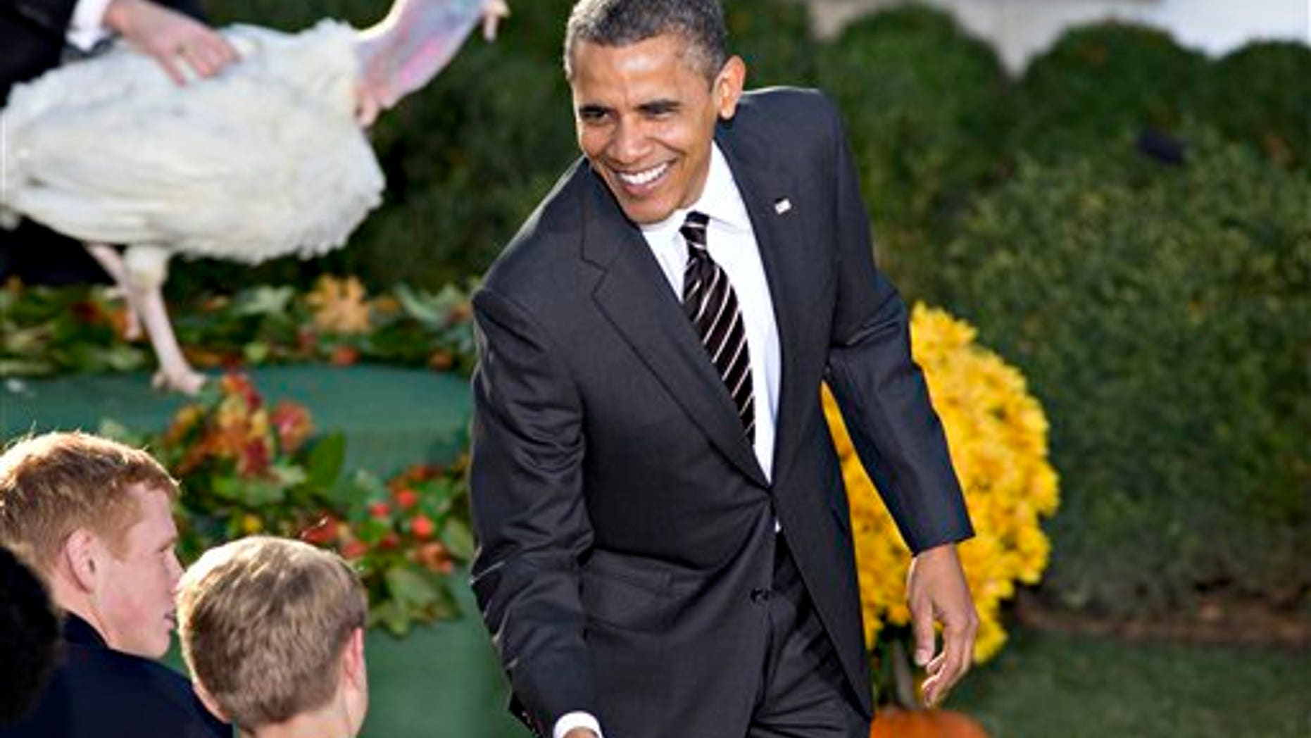 Nov. 21, 2012: President Obama shakes hands with White House visitors after carrying on the Thanksgiving tradition of saving a turkey from the dinner table with a "presidential pardon," in the Rose Garden of the White House.