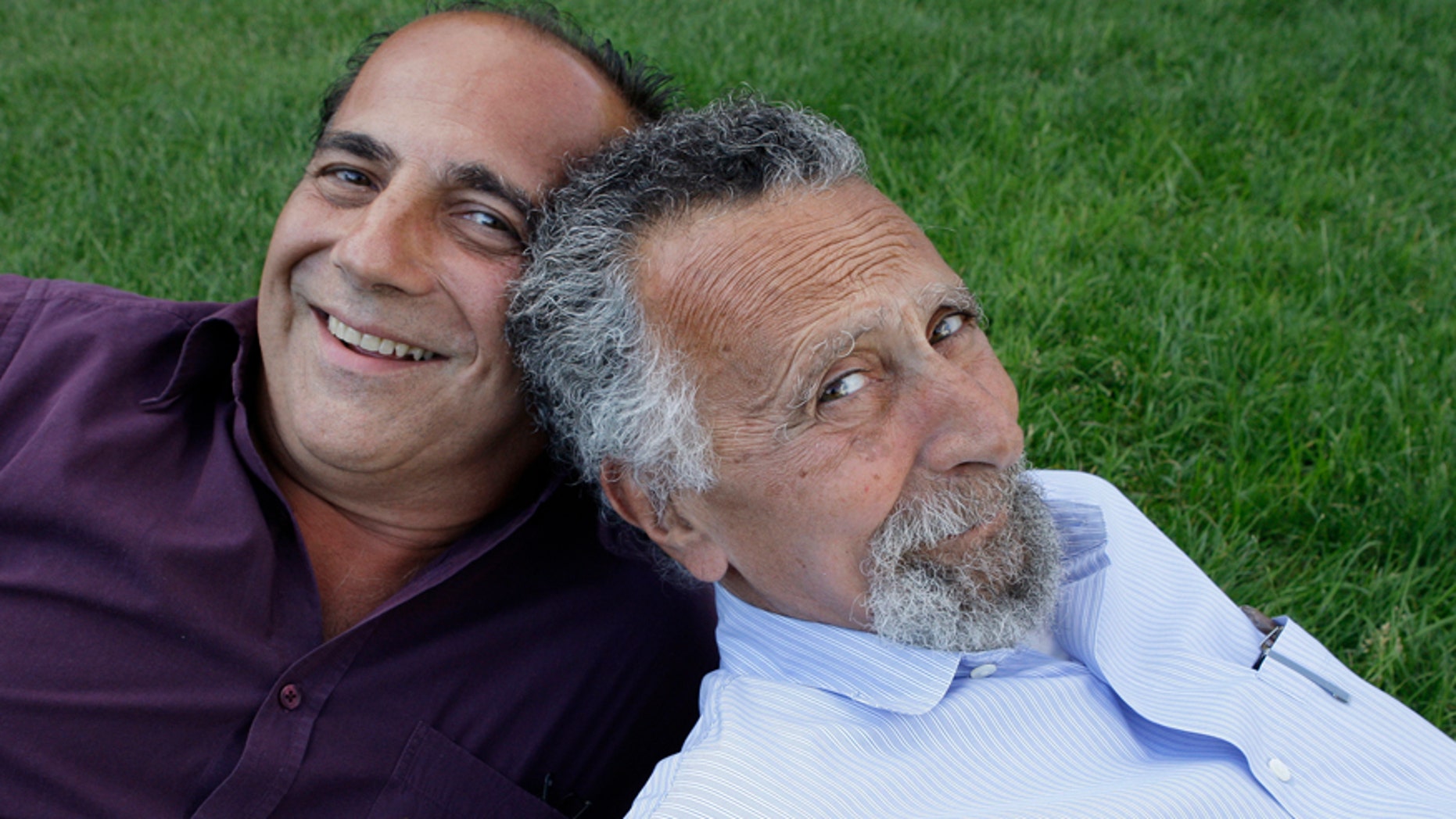 In this June 19, 2008 photo, brothers Ray, left, and Tom Magliozzi, co-hosts of National Public Radio's "Car Talk" show, pose for a photo in Cambridge, Mass. NPR says Tom Magliozzi died Monday, Nov. 3, 2014 of complications from Alzheimer's disease. He was 77. (AP Photo/Charles Krupa)