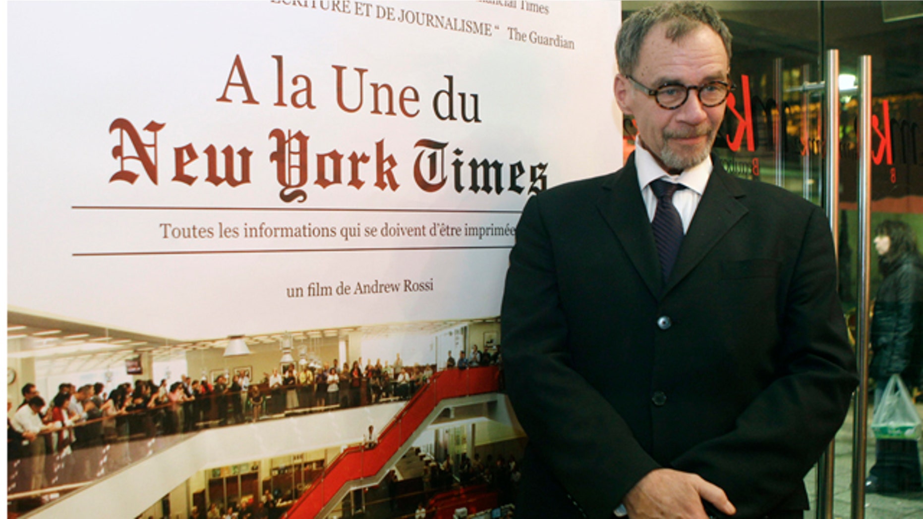 FILE - In this Nov. 21, 2011, file photo, New York Times journalist David Carr poses for a photograph as he arrives for the French premiere of the documentary 'Page One: A Year Inside The New York Times' in Paris. Carr collapsed at the office and died in a hospital Thursday, Feb. 12, 2015. He was 58. Carr wrote the Media Equation column for the Times, focusing on issues of media in relation to business and culture. (AP Photo/Michel Euler, File)