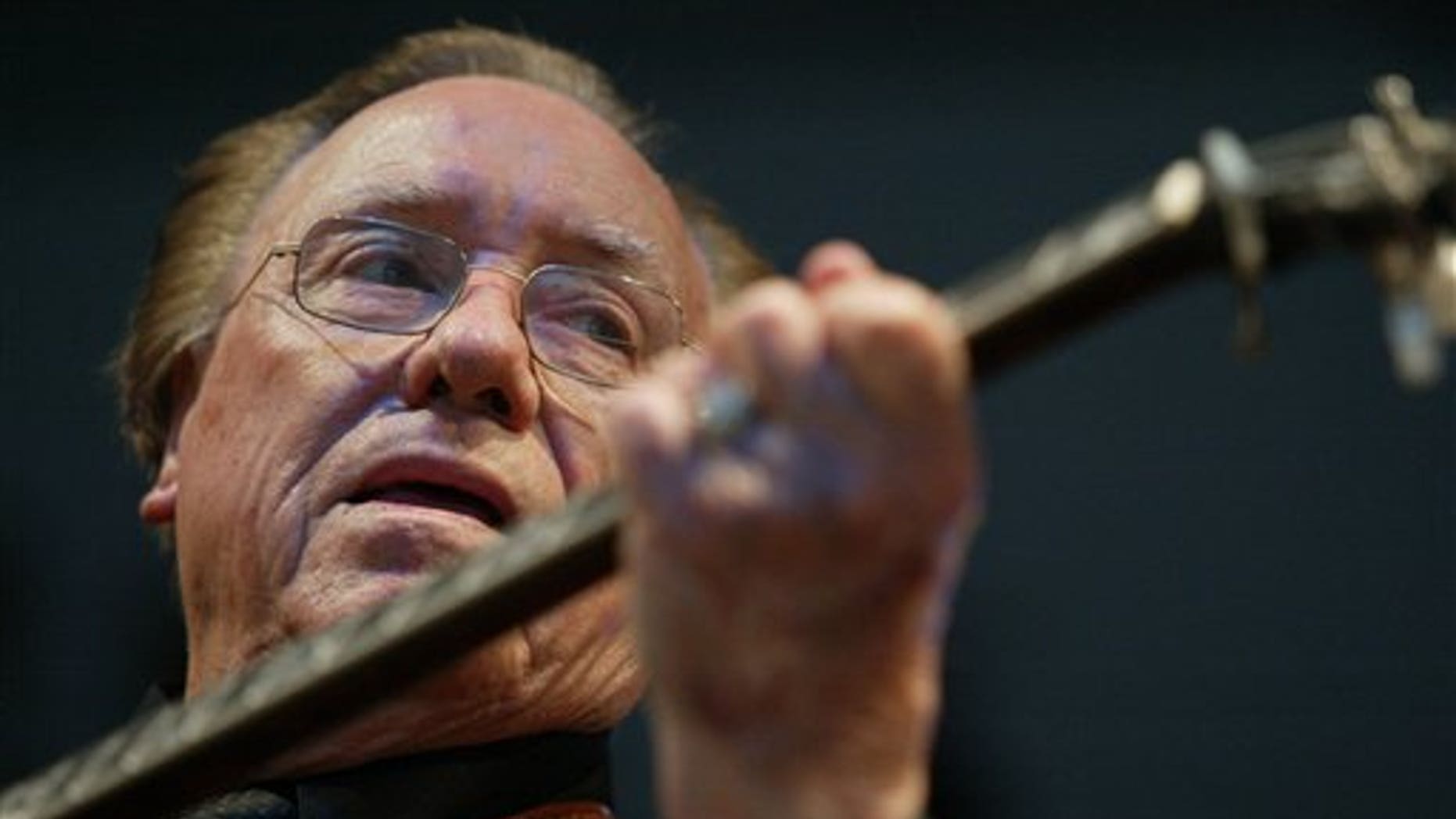In this June 10, 2005 file photo, Earl Scruggs, performs at the Bonnaroo Music & Arts Festival in Manchester, Tenn.