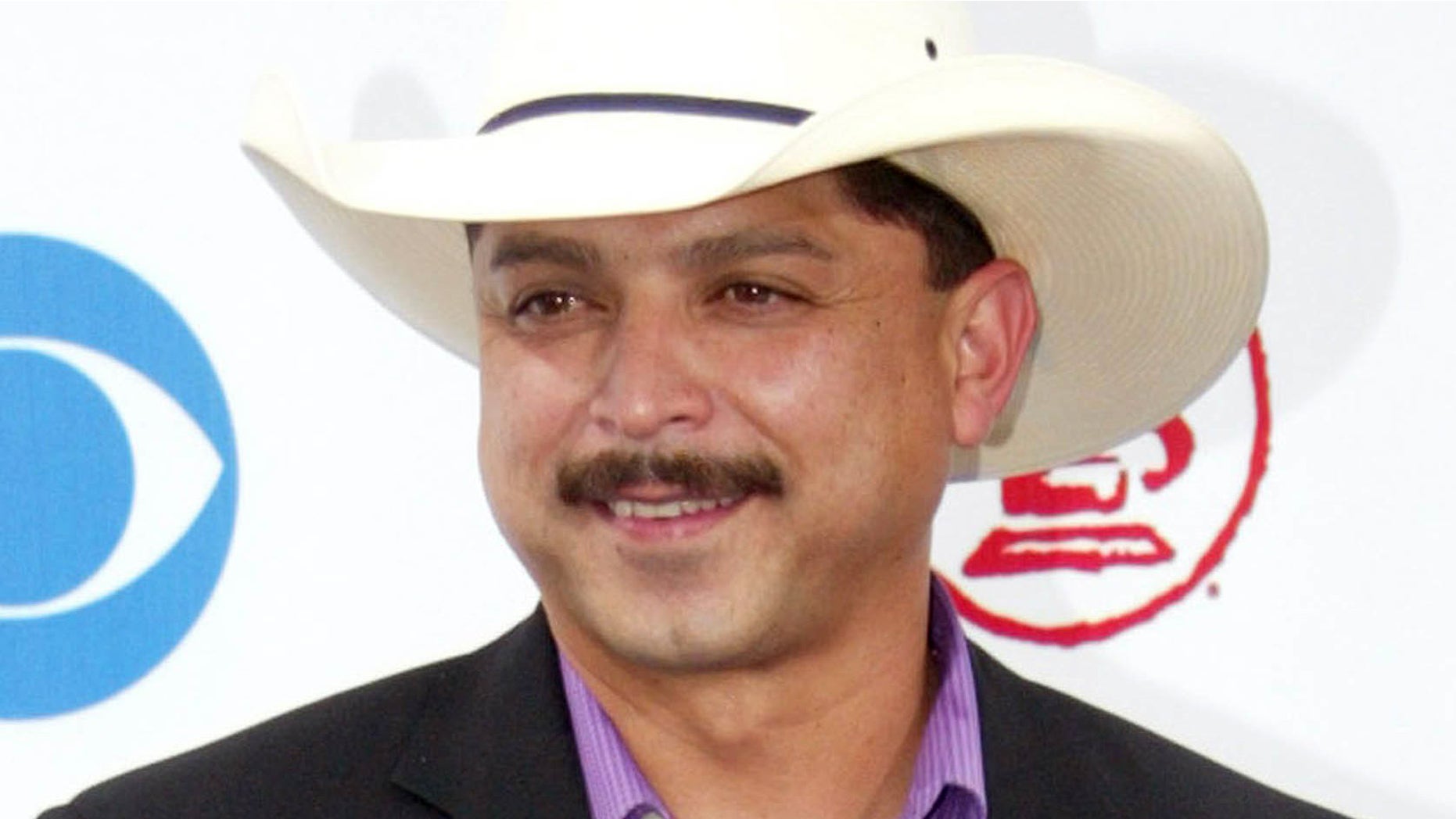 FILE - In this Sept. 3, 2003 file photo, Emilio Navaira arrives at the Latin Grammy Awards in Miami. The Grammy-winning Tejano star has died in New Braunfels, Texas. He was 53. Police in New Braunfels said in a statement Tuesday, May 17, 2017, that preliminary results indicate the entertainer died of natural causes. (AP Photo/Wilfredo Lee, file)