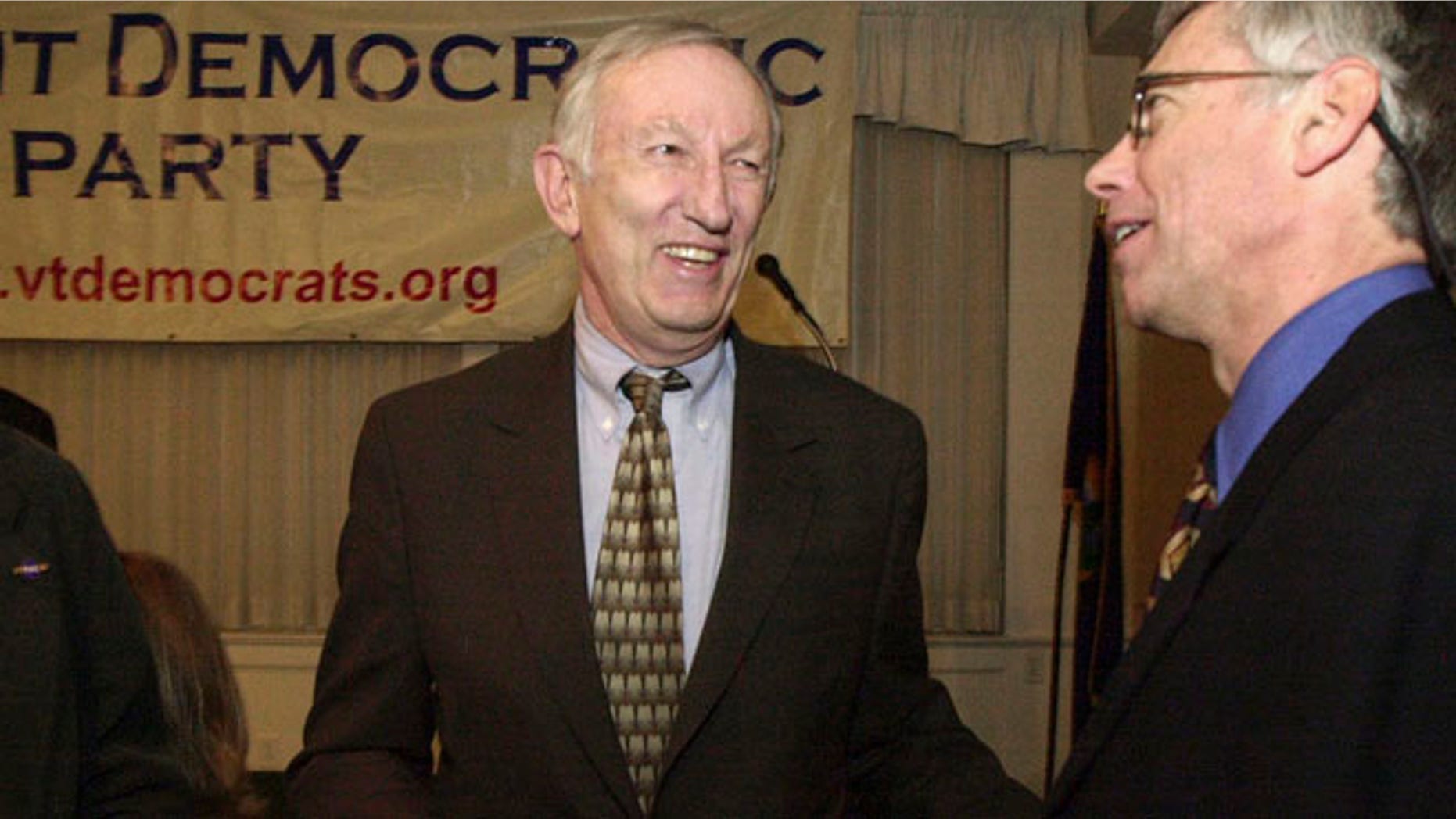 In this March 14, 2003, file photo, Sen. Jim Jeffords, I-Vt., center, laughs with Vermont Democratic Party Chairman Scudder Parker at the annual Democratic Party dinner in Montpelier, Vt.