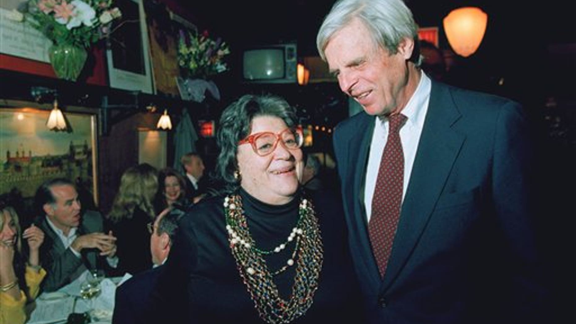 In this April 27, 1993 file photo, restaurateur Elaine Kaufman, left, stands with author George Plimpton at her restaurant "Elaines" in New York. (AP)