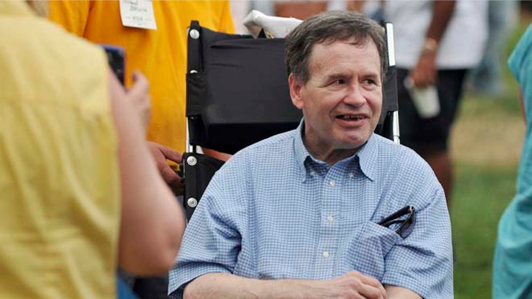 This Aug. 12, 2012 photo shows former Illinois Congressman Lane Evans in Davenport, Iowa, during a visit by President Barack Obama.