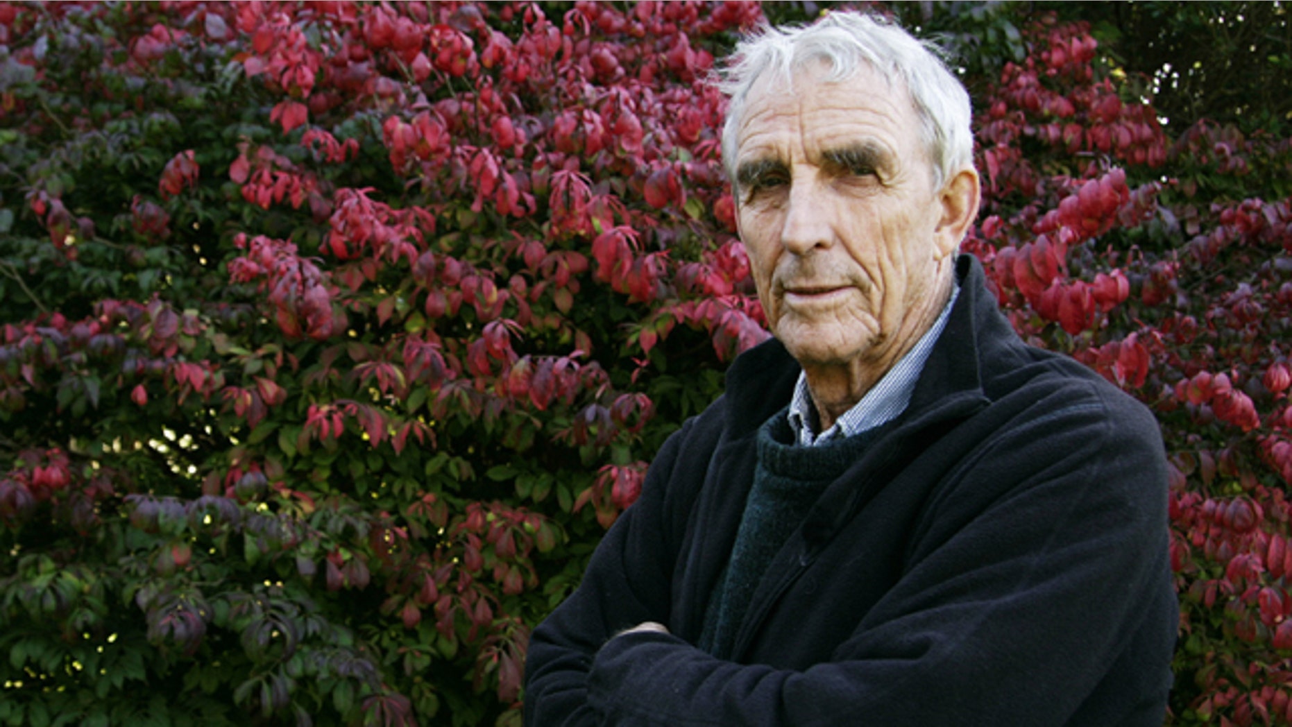 FILE - Writer Peter Matthiessen stands in the yard of his house in Sagaponack, N.Y. in this Oct. 28, 2004 file photo. Matthiessen, award-winning author of more than thirty books, world-renowned naturalist, explorer, Buddhist teacher, and political activist, died Saturday, April 5, 2014 after an illness of some months,according to his publisher Geoff Kloske of Riverhead Books. He was 86. (AP Photo/Ed Betz, File)