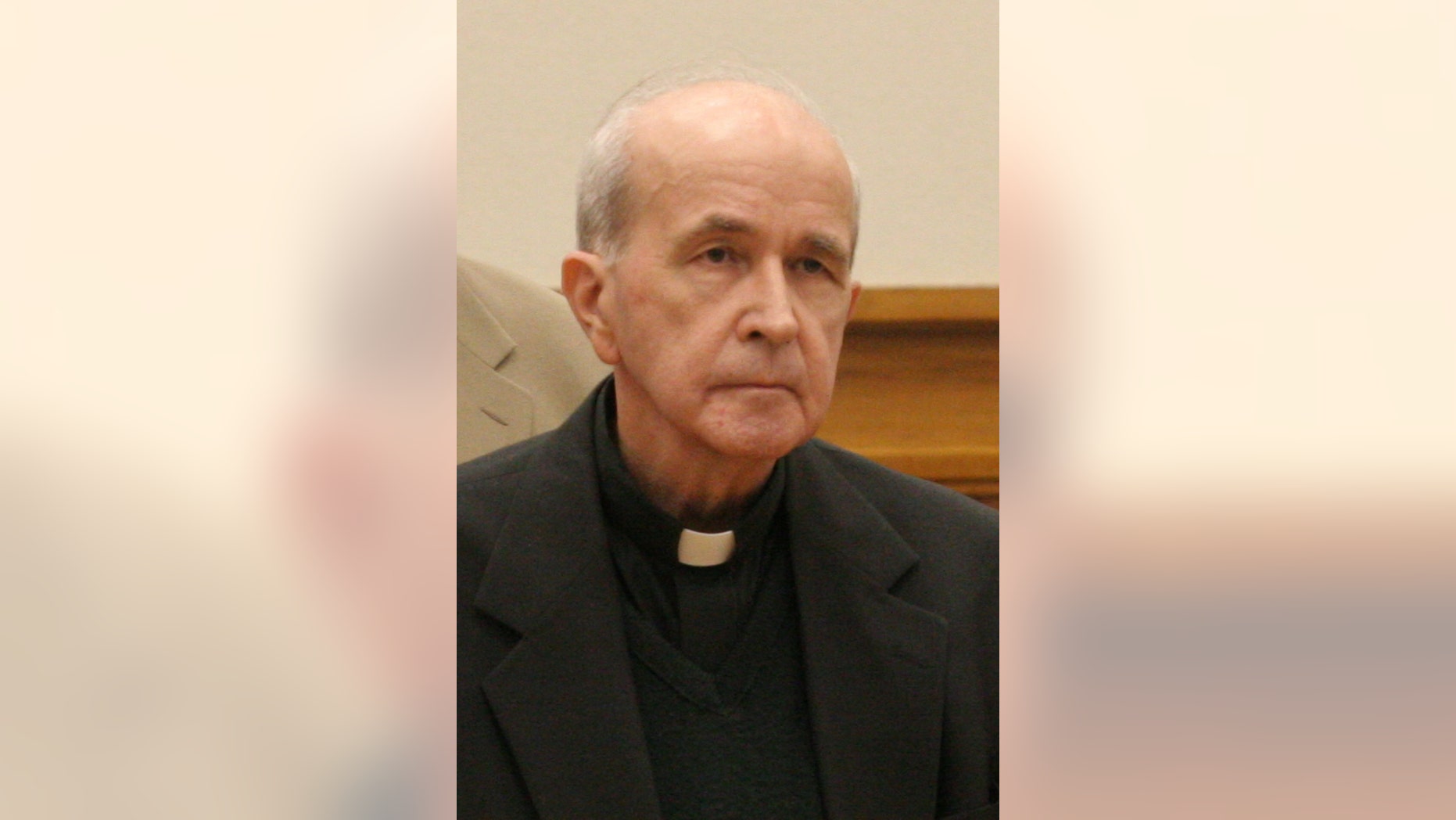 FILE - In this photo made Thursday, May 11, 2006, in Toledo, Ohio, the Rev. Gerald Robinson listens as the verdict is read finding him guilty of killing Sister Margaret Ann Pahl. Robinson, a Roman Catholic priest, died Friday morning, July 4, 2014, at a Columbus prison hospice unit, said his attorney, Richard Kerger. He was 76. A federal court had refused Thursday to release Robinson so he could die in his hometown, Toledo. (AP Photo/Andy Morrison, Pool, File)
