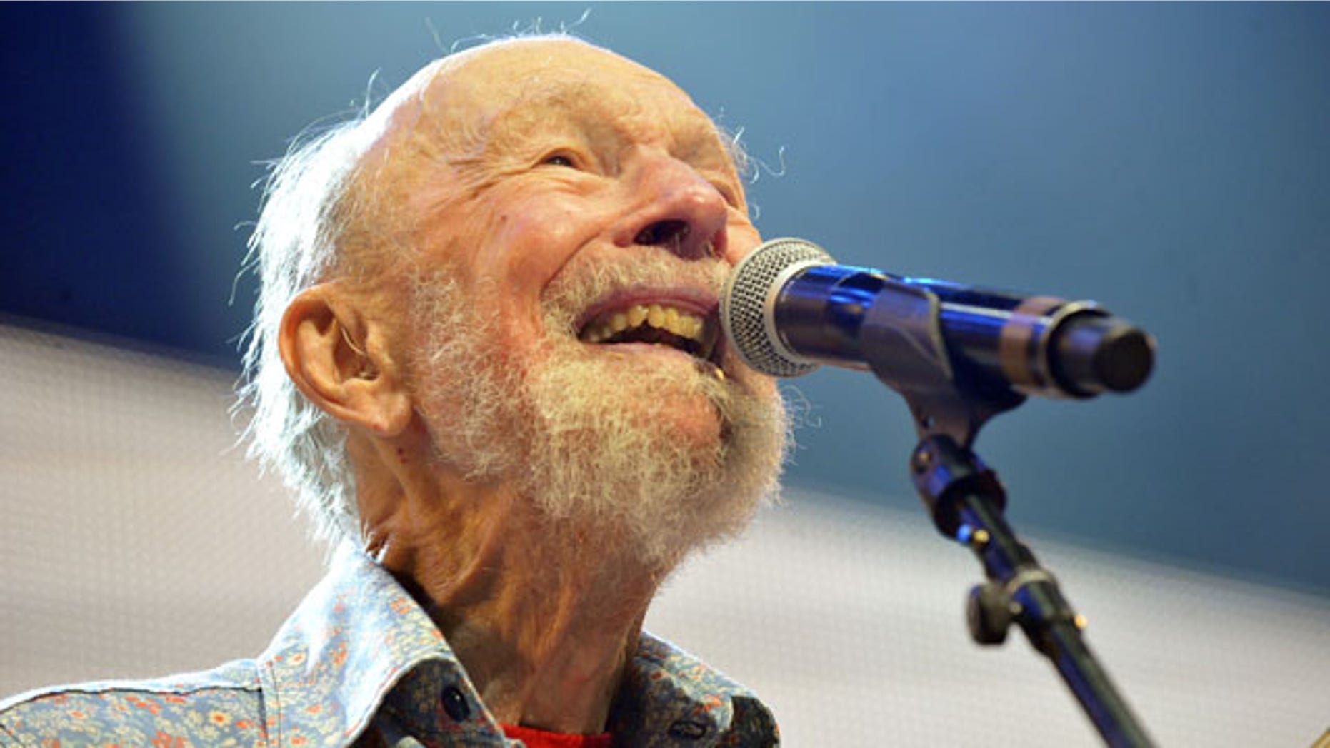 FILE -- Sept. 21, 2013: Pete Seeger performs on stage during the Farm Aid 2013 concert at Saratoga Performing Arts Center in Saratoga Springs, N.Y.