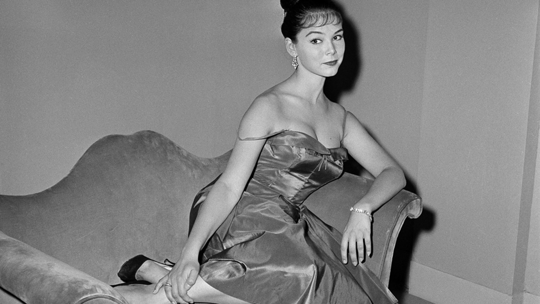 In this July 11, 1959, file photo, actress Yvonne Craig poses on the set of "The Gene Krupa Story," in Los Angeles.