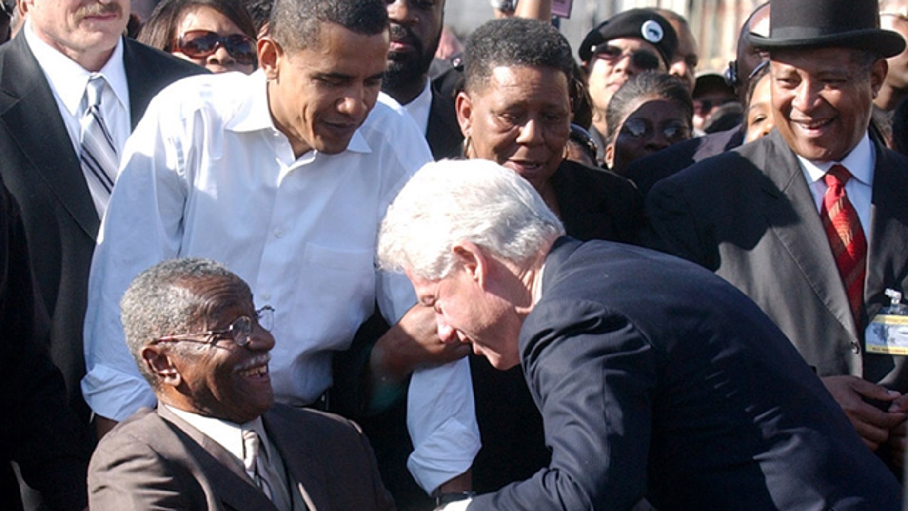 FILE 2007: Then-Senator Barack Obama, second from left, looks on as civil rights leader Fred Shuttlesworth, front left, greets former President Bill Clinton in Selma, Ala.