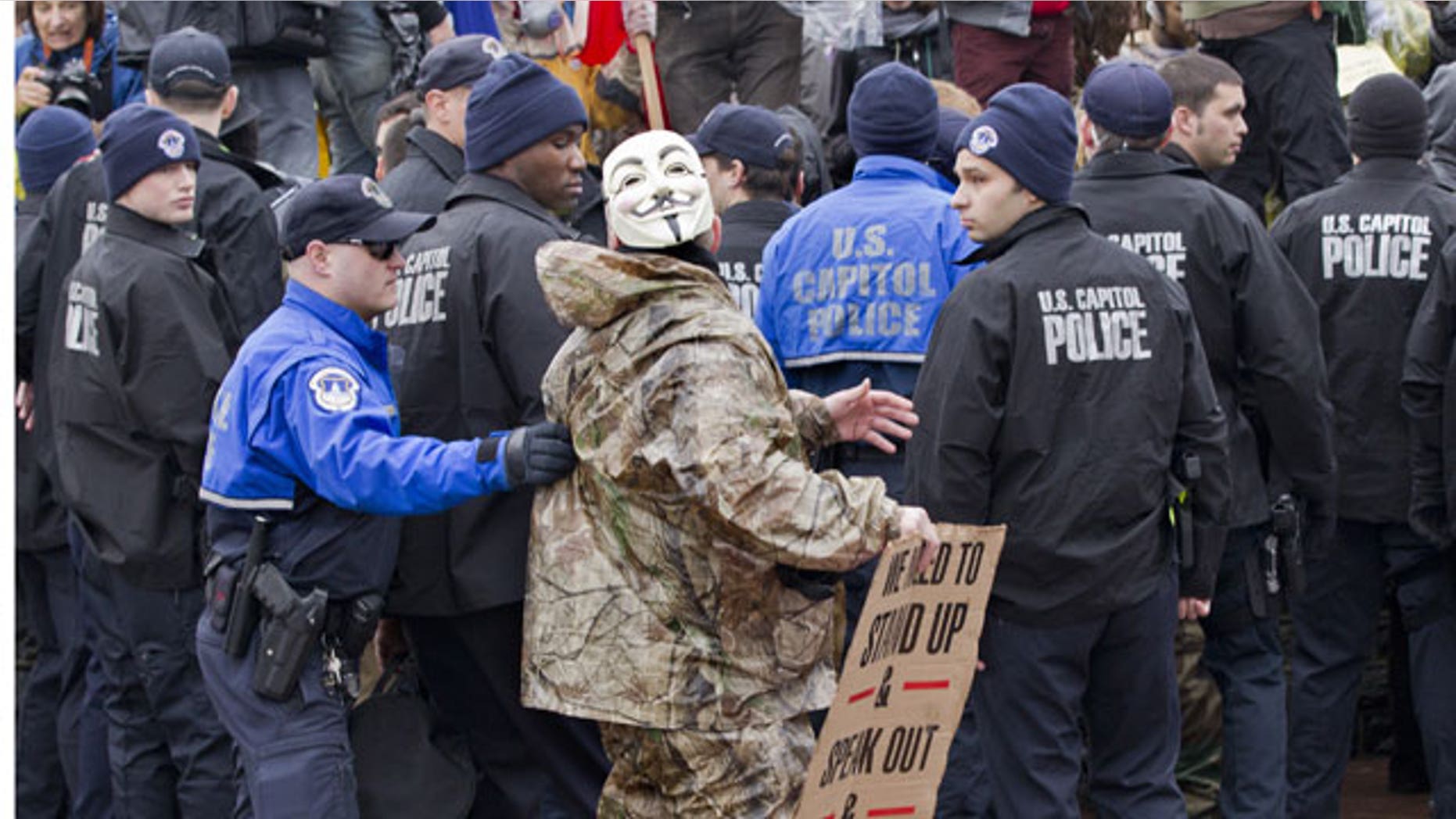 January 17, 2012: As Congress returns from its winter recess, protesters aligned with the Occupy Wall Street movement demonstrate on Capitol Hill in Washington to decry the influence of corporate money in politics.
