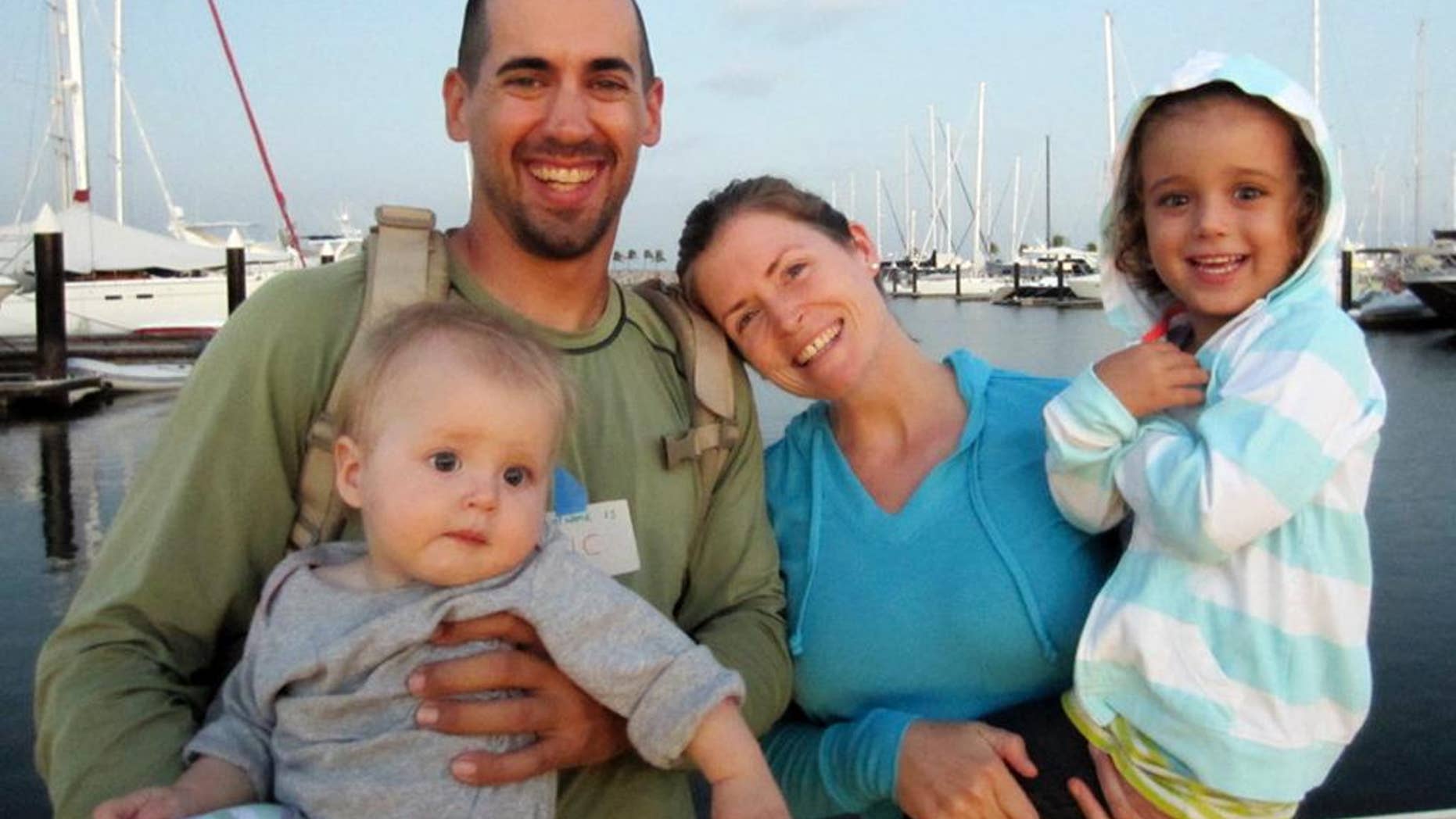 This undated image provided by Sariah English shows Eric and Charlotte Kaufman with their daughters, Lyra, 1, and Cora, 3. Rescuers have stabilized the condition Lyra, with her family on a crippled sailboat hundreds of miles off the coast of Mexico, and a U.S. Navy warship was headed toward the vessel, officials said Friday night, April 4, 2014. Their boat, the 36-foot Rebel Heart, was about 900 nautical miles southwest of Cabo San Lucas when they sent a satellite call for help to the U.S. Coast Guard Thursday morning saying their 1-year-old girl aboard was ill. (AP Photo/Sariah English)