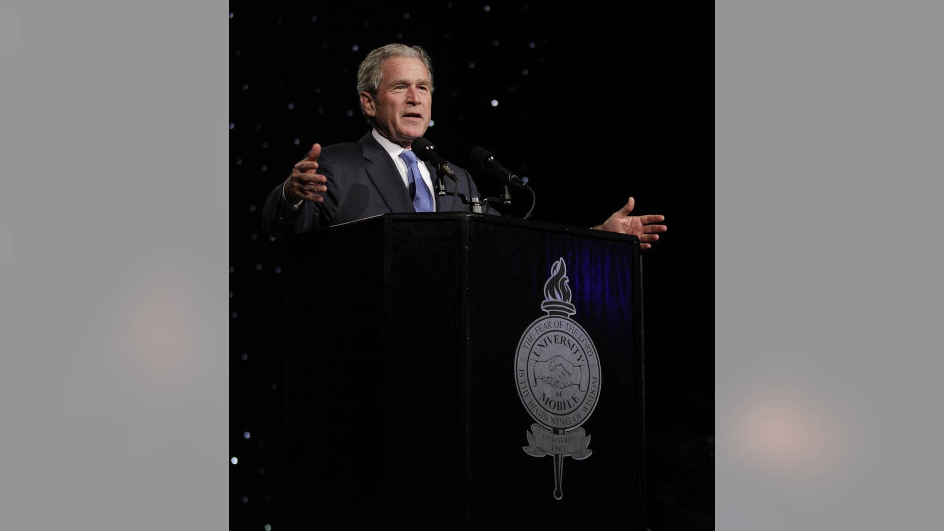 In a photo provided by the University of Mobile, former President George W. Bush addresses the 6th-annual University of Mobile Leadership Banquet at the Arthur Outlaw Convention Center Thursday, Oct.7, 2010 in Mobile, Ala. (AP Photo/University of Mobile)