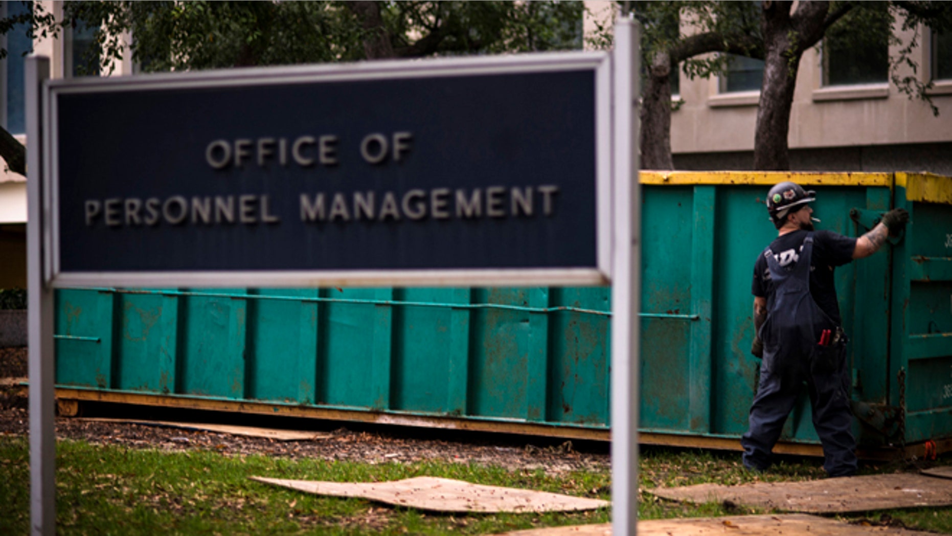 In this Thursday, Oct. 17, 2013 photo, a worker is seen at the Office of Personnel Management in Washington.