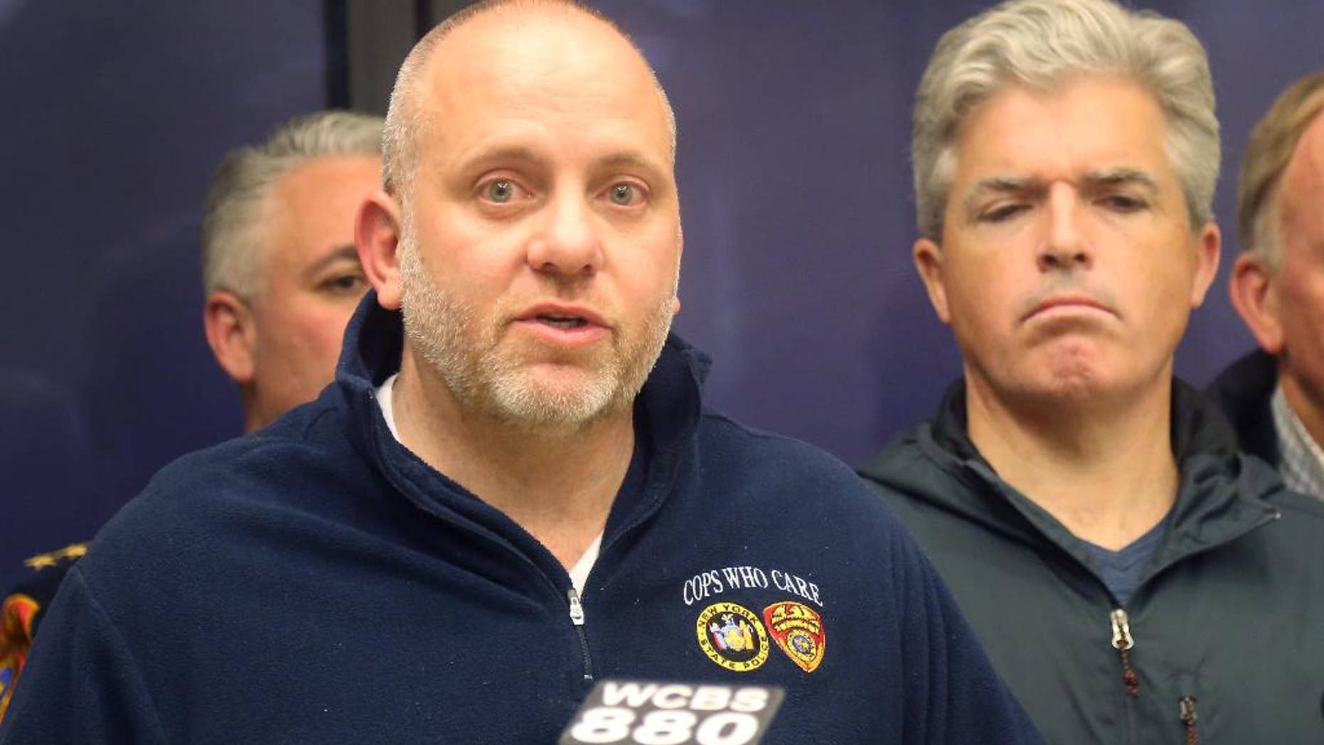 Noel DiGerolamo, left, President of the Suffolk County Police Benevolent Association, and Suffolk County Executive Steven Bellone, speak with reporters at a news conference at Stony Brook University Hospital, Thursday, March 12, 2015 in Stony Brook, N.Y. A Suffolk County police officer was shot and wounded while confronting a suspect who fled a traffic stop, police officials said. Officer Mark Collins, who is expected to survive, was in plain-clothes and driving an unmarked vehicle when he stopped a car for a vehicle and traffic violation on Route 25 in Huntington Station. A suspect is in custody. (AP Photo/Mike Balsamo)