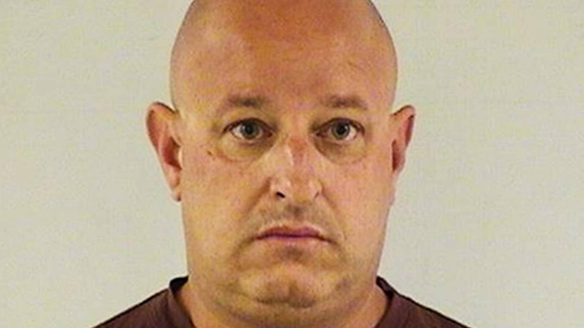 This undated photo provided by the Lake County Sheriff's Office shows Joseph A. Battaglia, a retired Chicago police officer who was arrested and charged with threatening investigators in the case of slain Fox Lake Police Lt. Charles Joseph Gliniewicz. Battaglia is scheduled to appear in court Tuesday, Sept. 15, 2015, in Waukegan, Ill., where a judge is expected to ask Battaglia if he's hired an attorney. At an initial hearing, he was told he doesn't qualify for a public defender. (Lake County Sheriff's Office via AP)