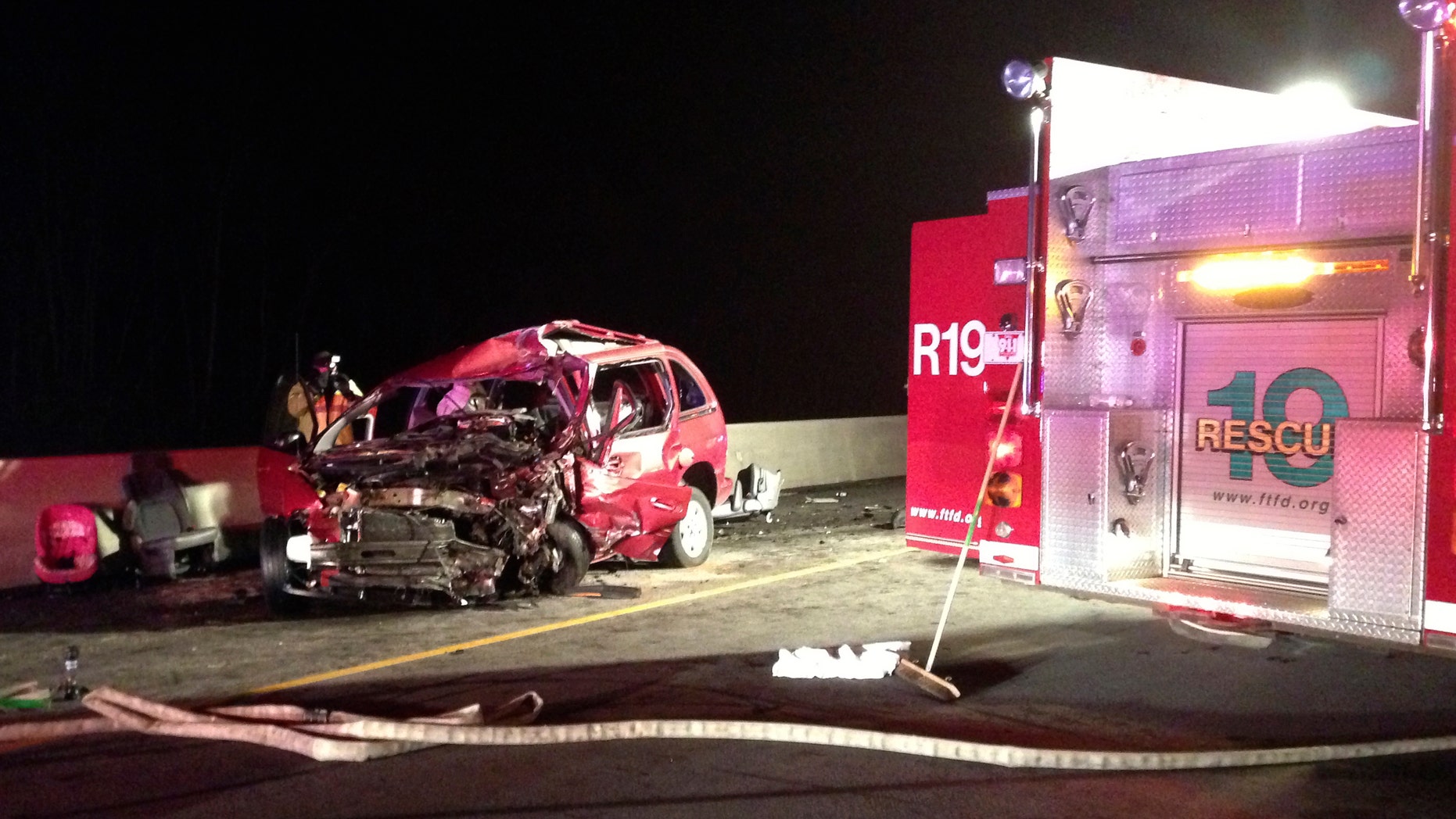 Dec. 23, 2012: A person takes photos of at the scene of a head-on collision involving two minivans on Interstate 75 near Franklin, Ohio.