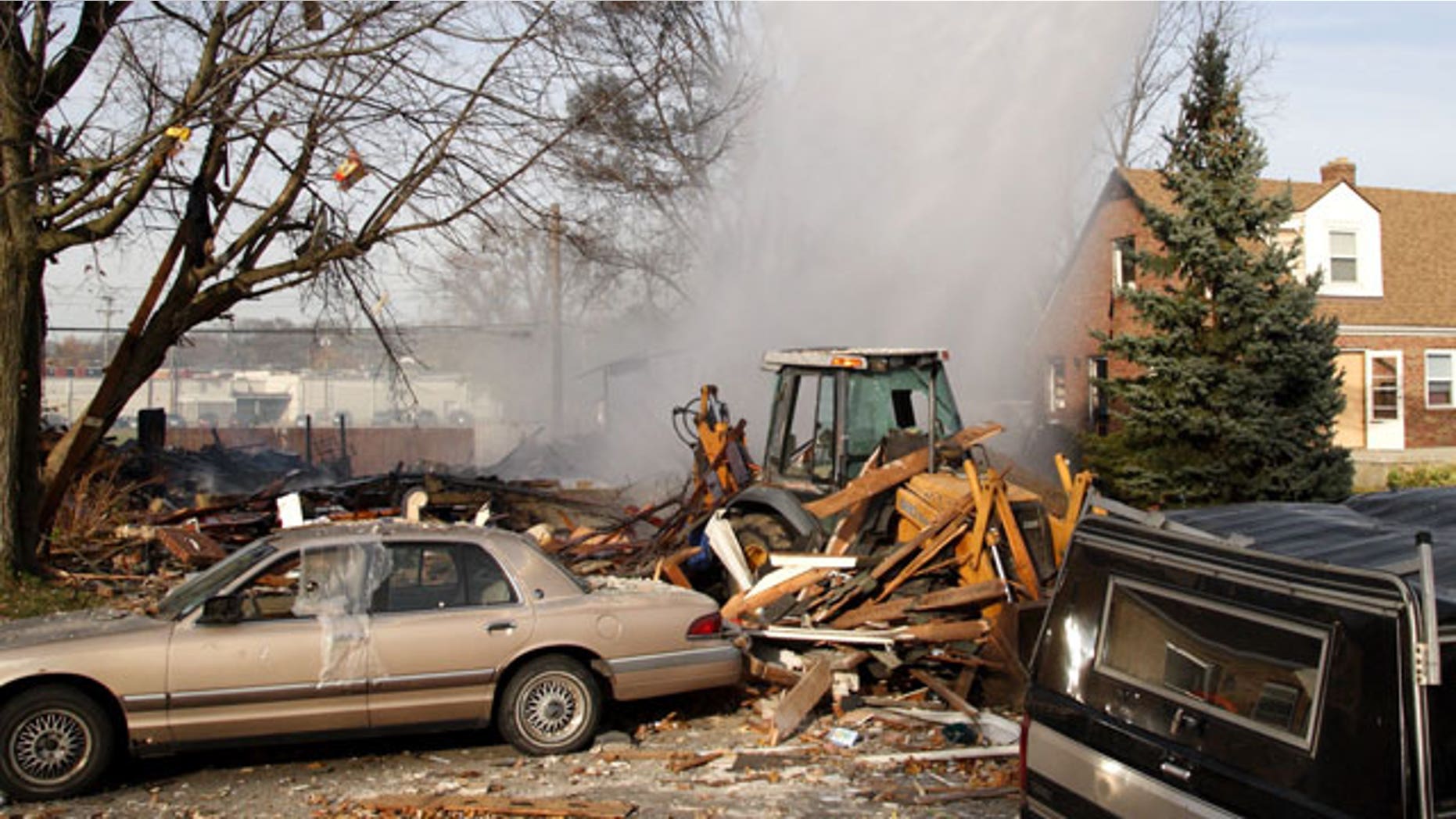 November 12, 2011: Firefighters pour water on a house explosion on Wayne Drive in Fairborn, Ohio. An official says a house exploded in western Ohio, leaving five people injured and one missing. At least three of the injured are children.