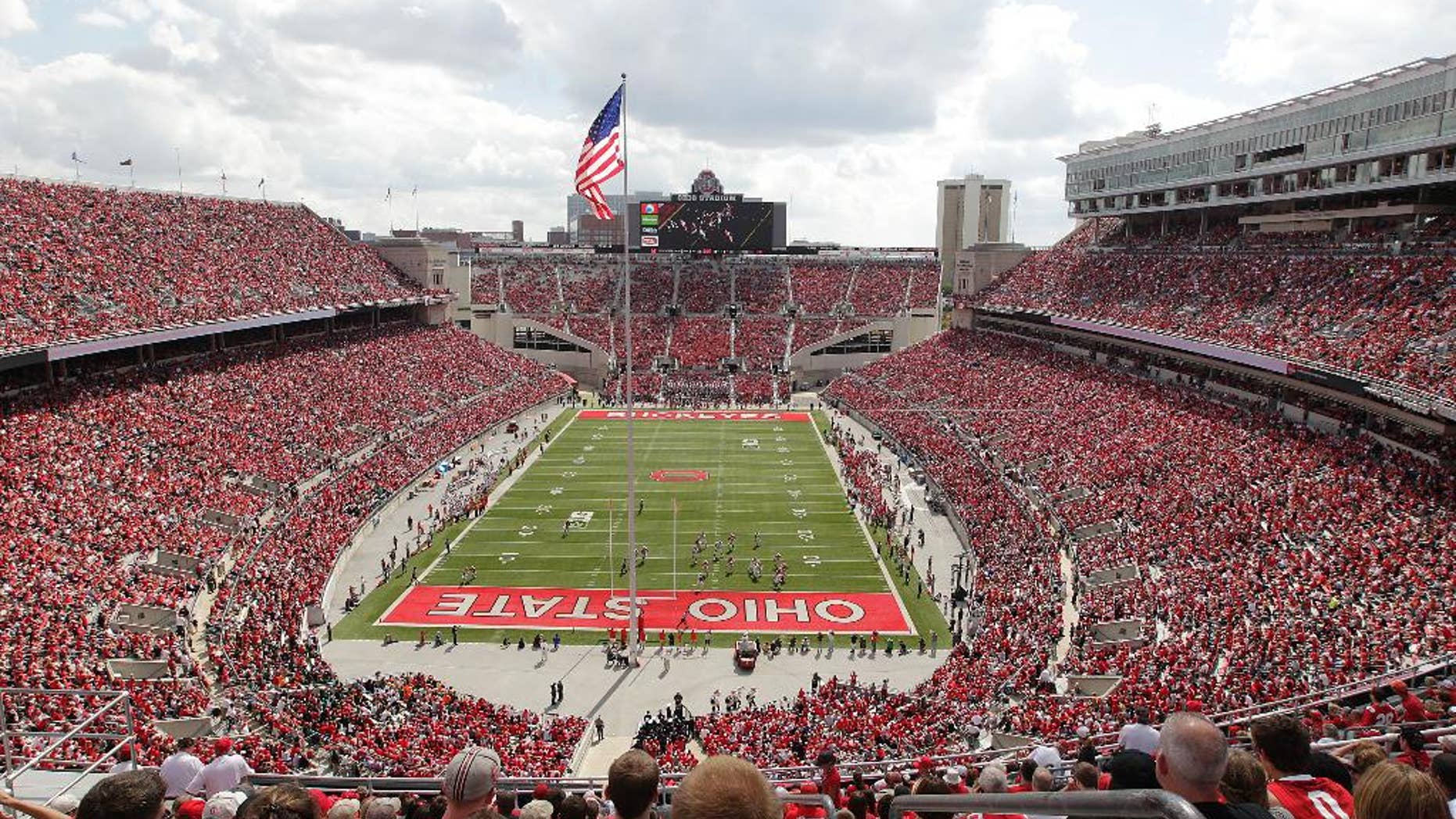 FILE - In this Sept. 21, 2013, file photo, Ohio State plays against Florida A&M at Ohio Stadium during an NCAA college football game in Columbus, Ohio. While Michigan has Michigan State and Indiana has Purdue and Notre Dame, Ohio State has no real big-time football competition within its borders. Or, at least, it hasn't for more than 90 years. The Buckeyes have won their last 38 meetings with other colleges from the state heading into Saturday’s game against Kent State. (AP Photo/Jay LaPrete, File)