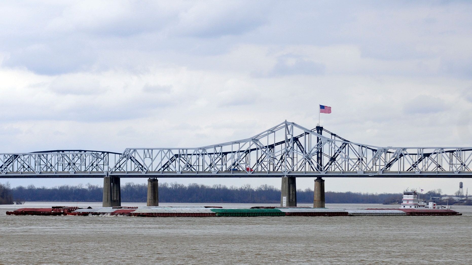 Jan. 30, 2013: The towboat Harold B. Dodd pilots south on the Mississippi River as vehicles cross the Interstate 20 bridge in Vicksburg, Miss.