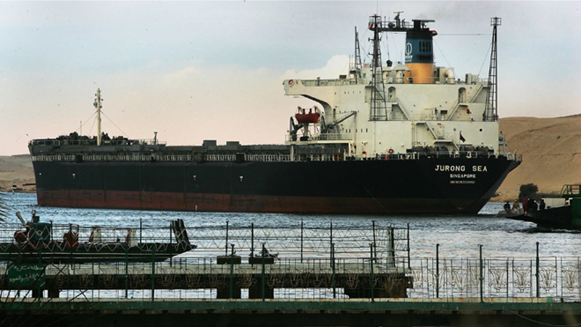 An international oil tanker passes through the Suez canal in Ismailia, Egypt December 14, 2004. (Photo by Scott Nelson/Getty Images)
