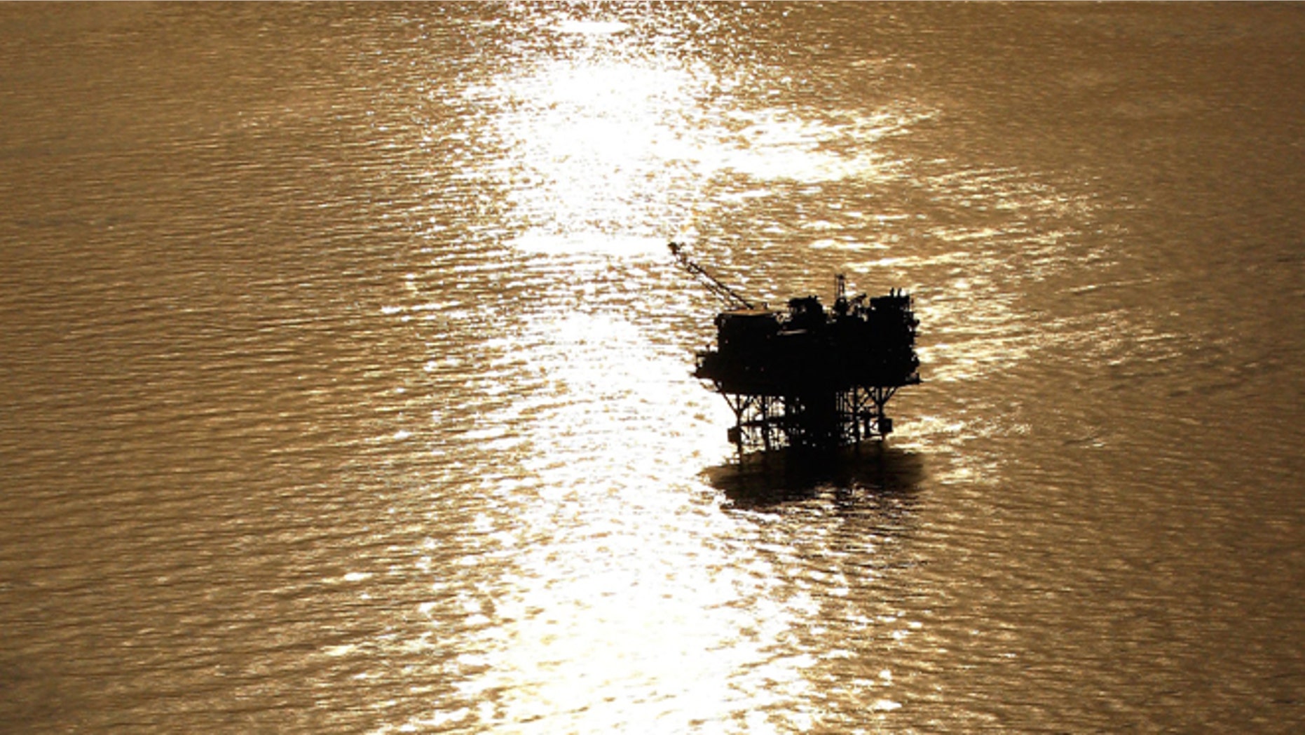 NEW ORLEANS - APRIL 28: Oil platforms sit in the Gulf of Mexico near the Louisiana coast line on April 28, 2010. (Photo by Chris Graythen/Getty Images)