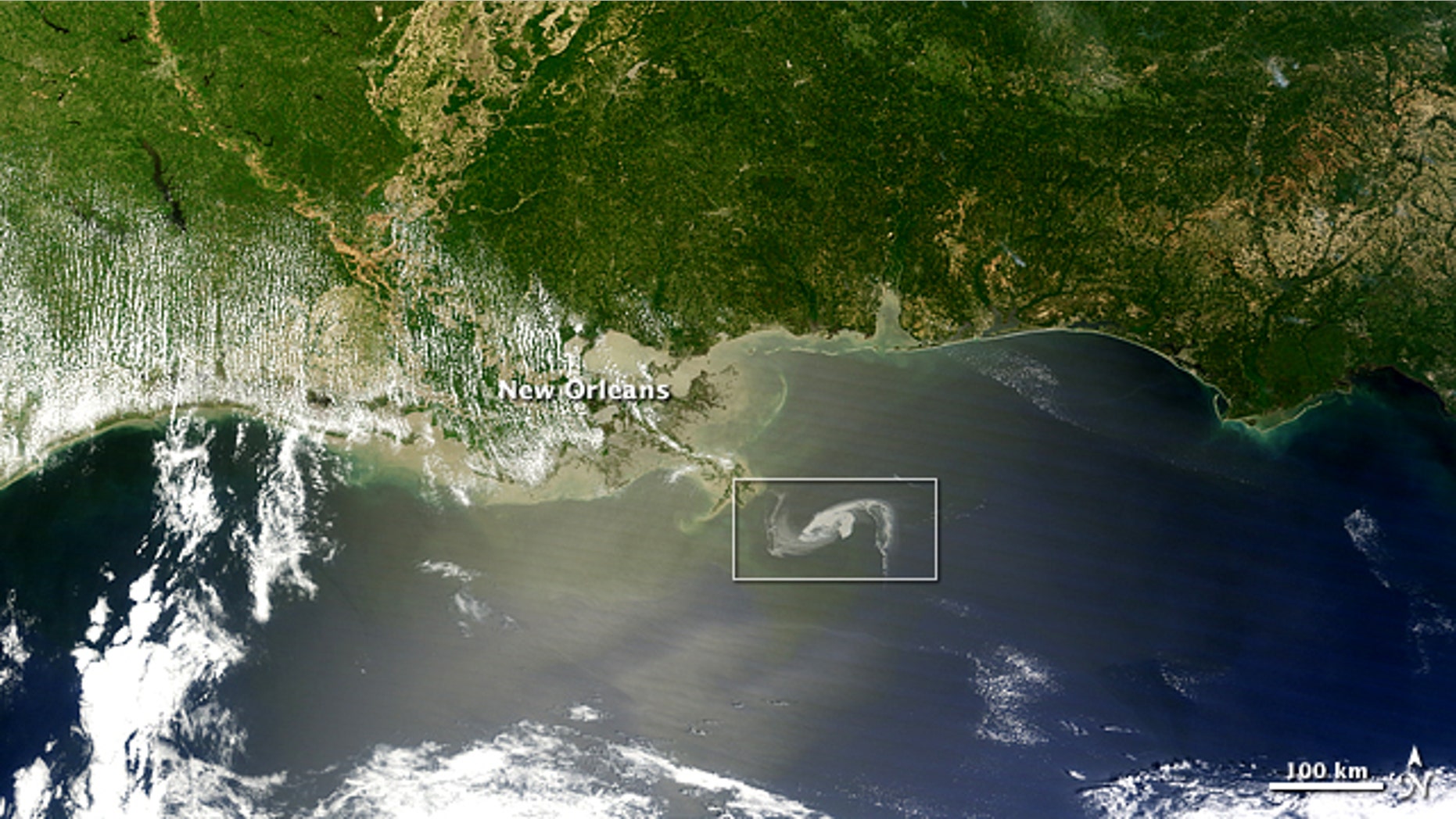 A massive oil slick in the Gulf of Mexico continued spreading on April 29, 2010, moving perilously close to shore. The Moderate Resolution Imaging Spectroradiometer (MODIS) on NASA’s Terra satellite captured a natural-color image of the oil slick just off the Louisiana coast. Here a wide-area view. The oil slick appears as dull gray interlocking comma shapes, one opaque and the other nearly transparent. The northwestern tip of the oil slick almost touches the Mississippi Delta.