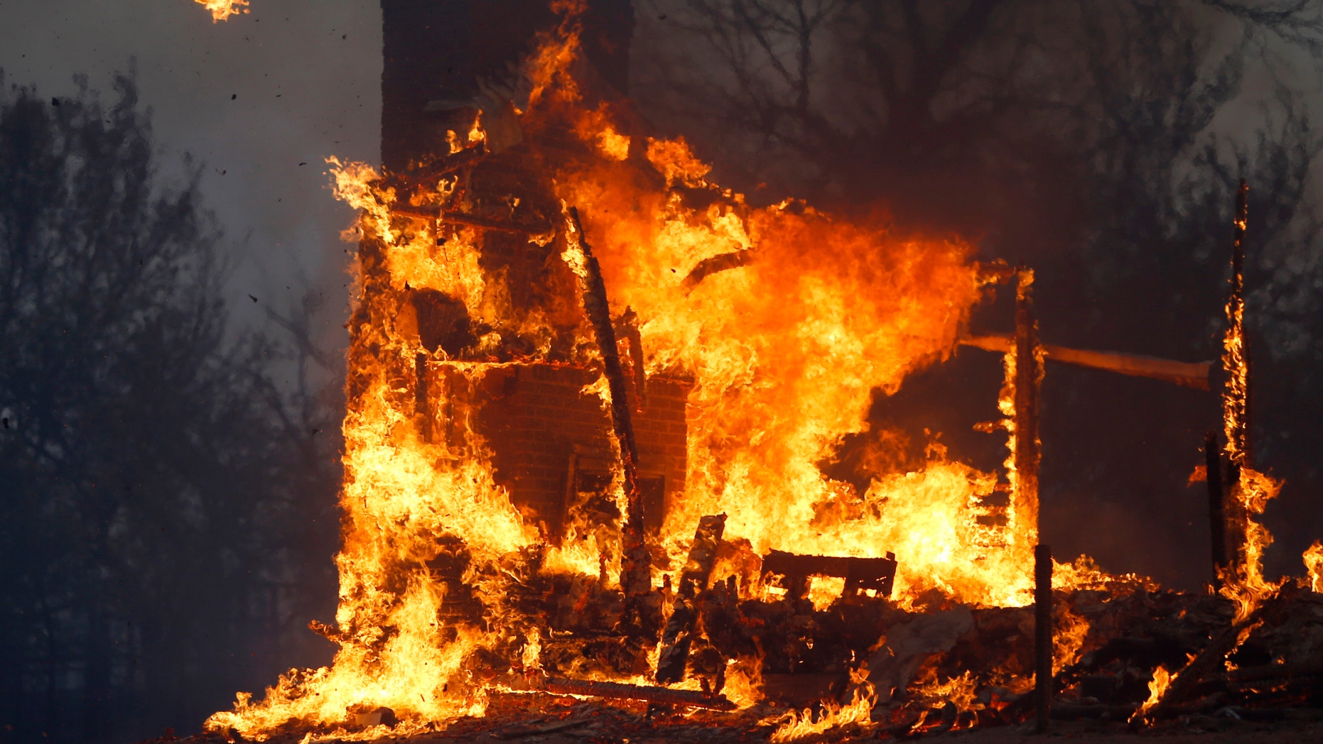 Aug. 3, 2012: A home burns during a large wildfire.