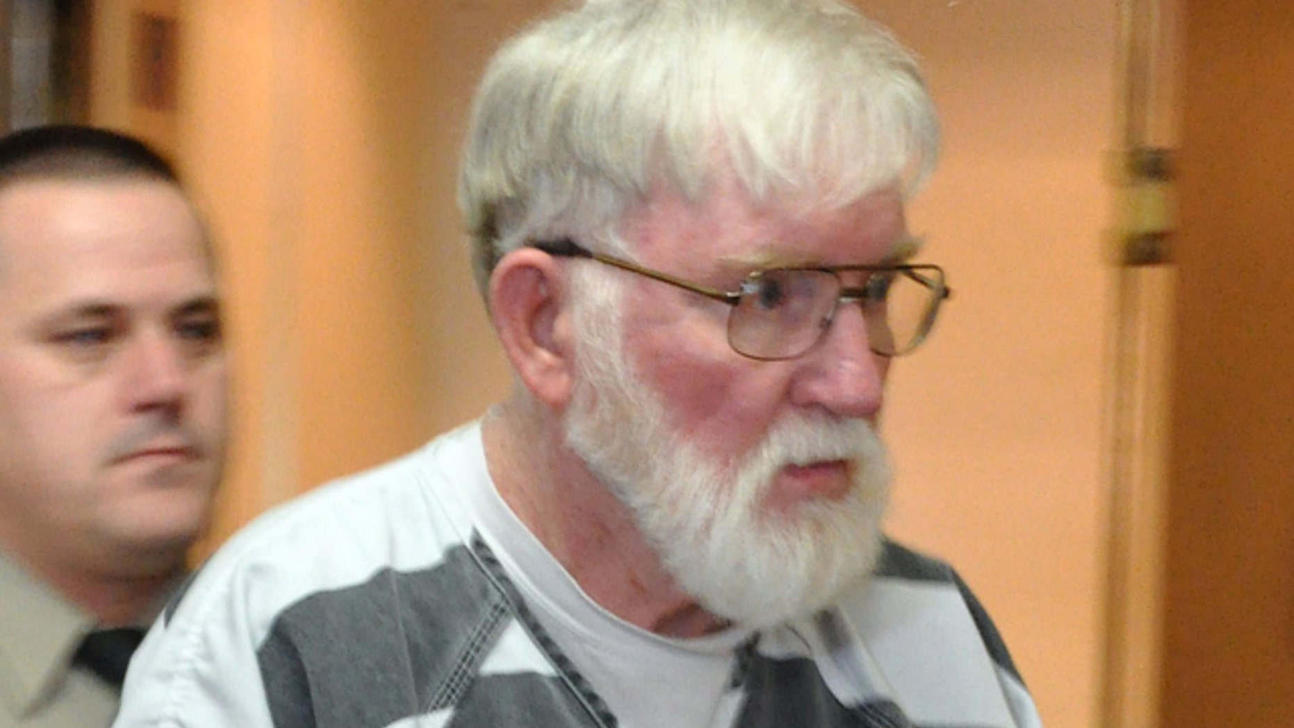 Feb. 2, 2012: In this file photo, Carl V. Ericsson, 73, is led into a Lake County courtroom for a bond hearing on a first-degree murder charge in Madison, S.D. Ericsson was sentenced to life in prison, after pleading guilty but mentally ill last month to second-degree murder.