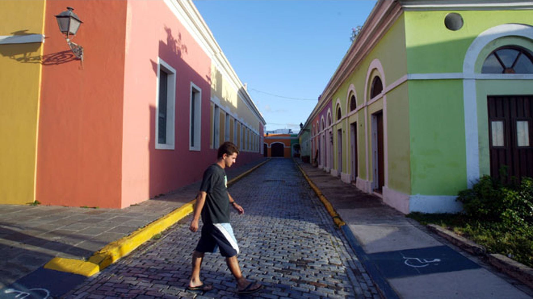 SAN JUAN, PUERTO RICO- APRIL 25: Colorful homes line the cobblestoned streets April 25, 2004 in Old San Juan, the original capital city of San Juan, Puerto Rico. The old city is a historic district of seven square blocks made up of ancient buildings and colonial homes, massive stone walls and vast fortifications, sunny parks and cobblestoned streets. (Photo by Joe Raedle/Getty Images)