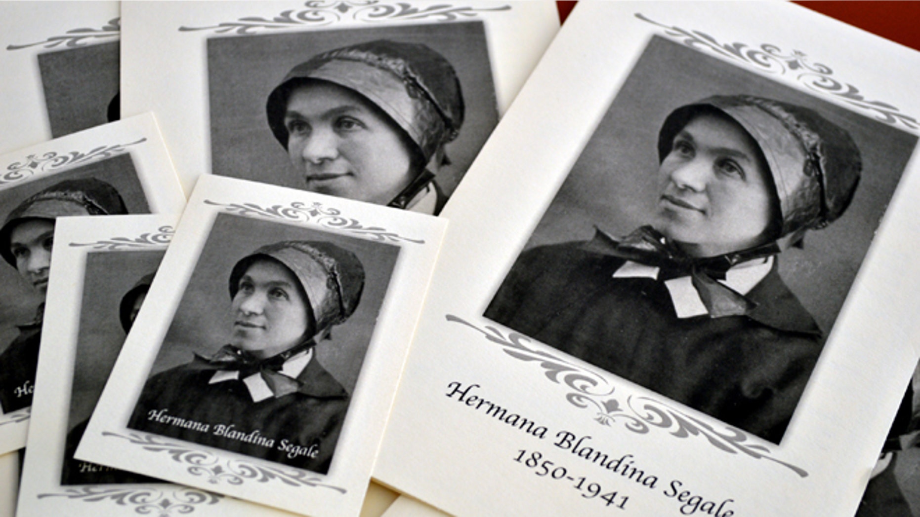 FILE - This Aug. 25, 2015 file photo pamphlets and prayer cards of Sister Blandina Segale sit on a table at the Catholic Center in Albuquerque, N.M. Segale an Italian-born nun who challenged Billy the Kid, calmed angry mobs and helped open New Mexico territory hospitals and schools is set to move up the path toward possible sainthood. The Archdiocese of Santa Fe is scheduled Friday, Nov. 13, to close its inquiry on why Segale should become a saint. The inquiry panel will then forward its findings to the Vatican. (AP Photo/Russell Contreras, File)