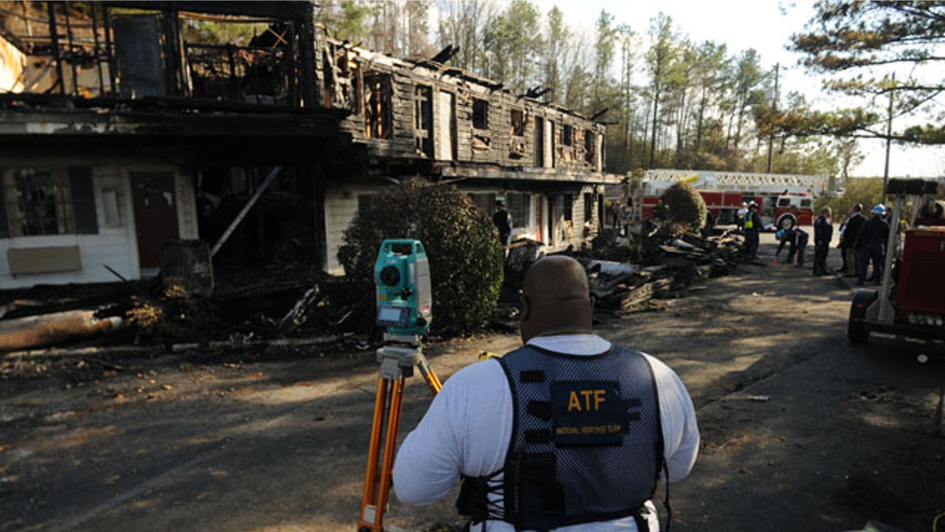 In this Jan. 18, 2010 photo, an investigator with the Bureau of Alcohol, Tobacco, Firearms and Explosives works at the site of a fatal fire which killed four Mississippi college students at the Days Inn in Hoover, Ala. (AP)