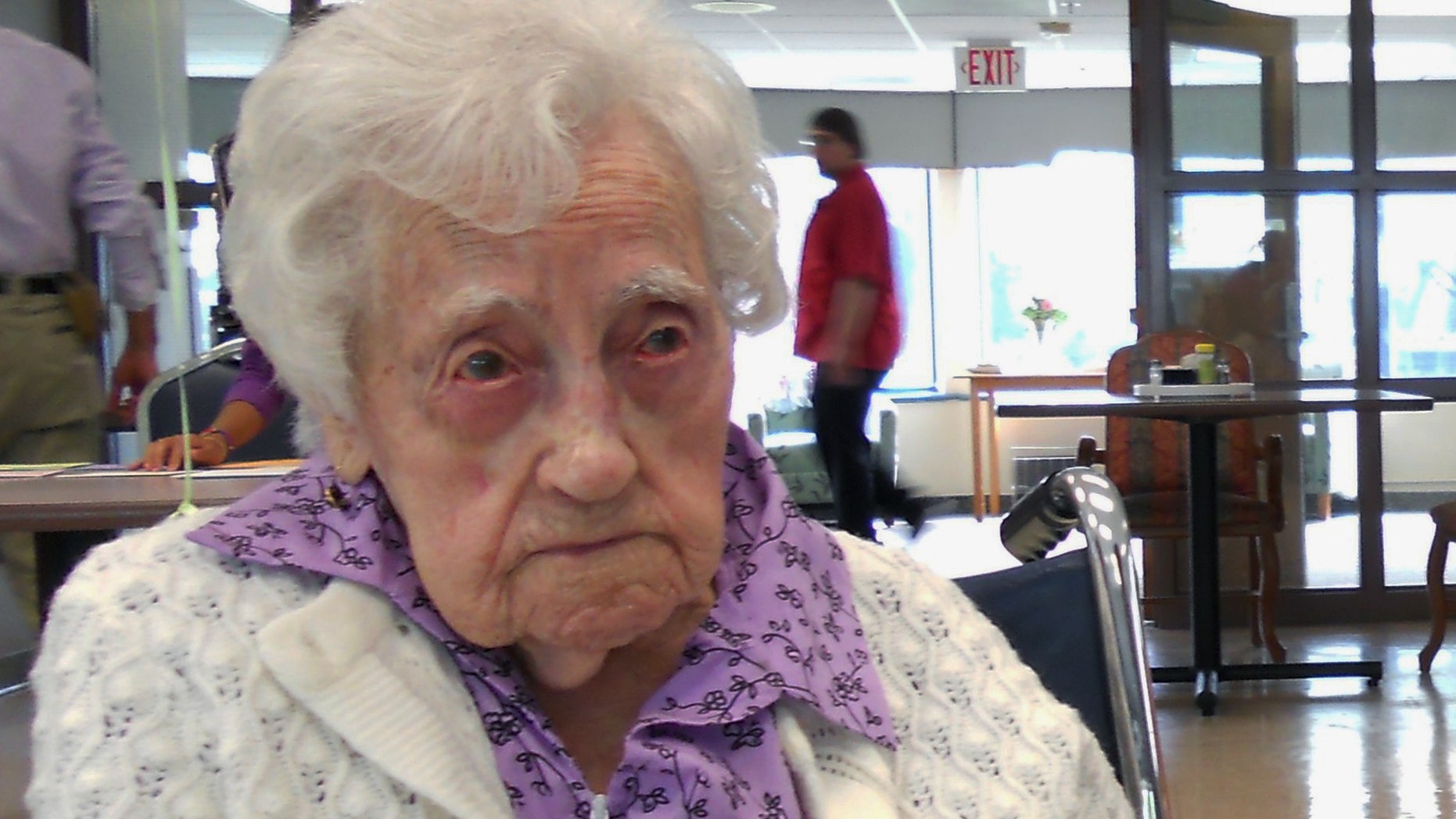 This April 4, 2012 photo family photo provided by Lori Logli shows her grandmother Dina Manfredini at her 115th birthday party in Johnston, Iowa. Mandredini, who inherited the title of worldís oldest person less than two weeks ago died Monday, Dec. 17, 2012 at age 115, Logli said.