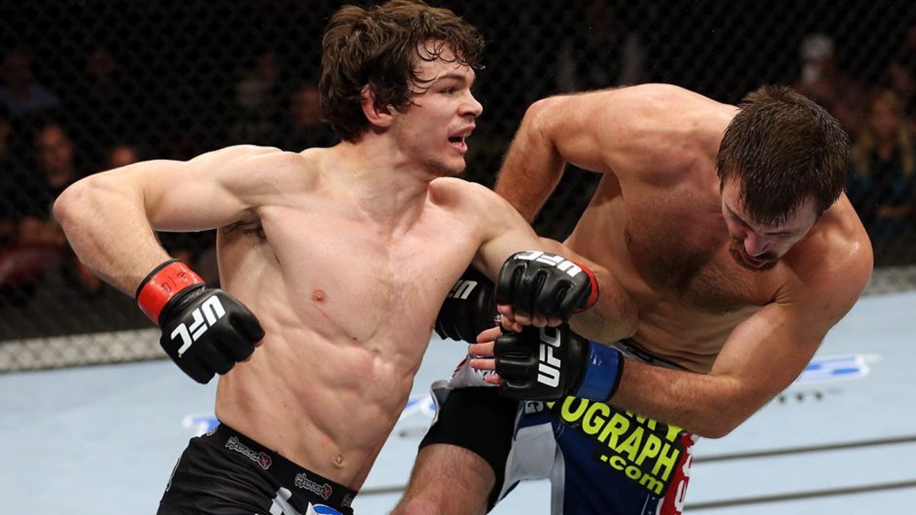 HALIFAX, NS - OCTOBER 4: (L-R) Olivier Aubin-Mercier of Canada punches Jake Lindsey in their welterweight bout at the Scotiabank Centre on October 4, 2014 in Halifax, Nova Scotia, Canada. (Photo by Nick Laham/Zuffa LLC/Zuffa LLC via Getty Images)