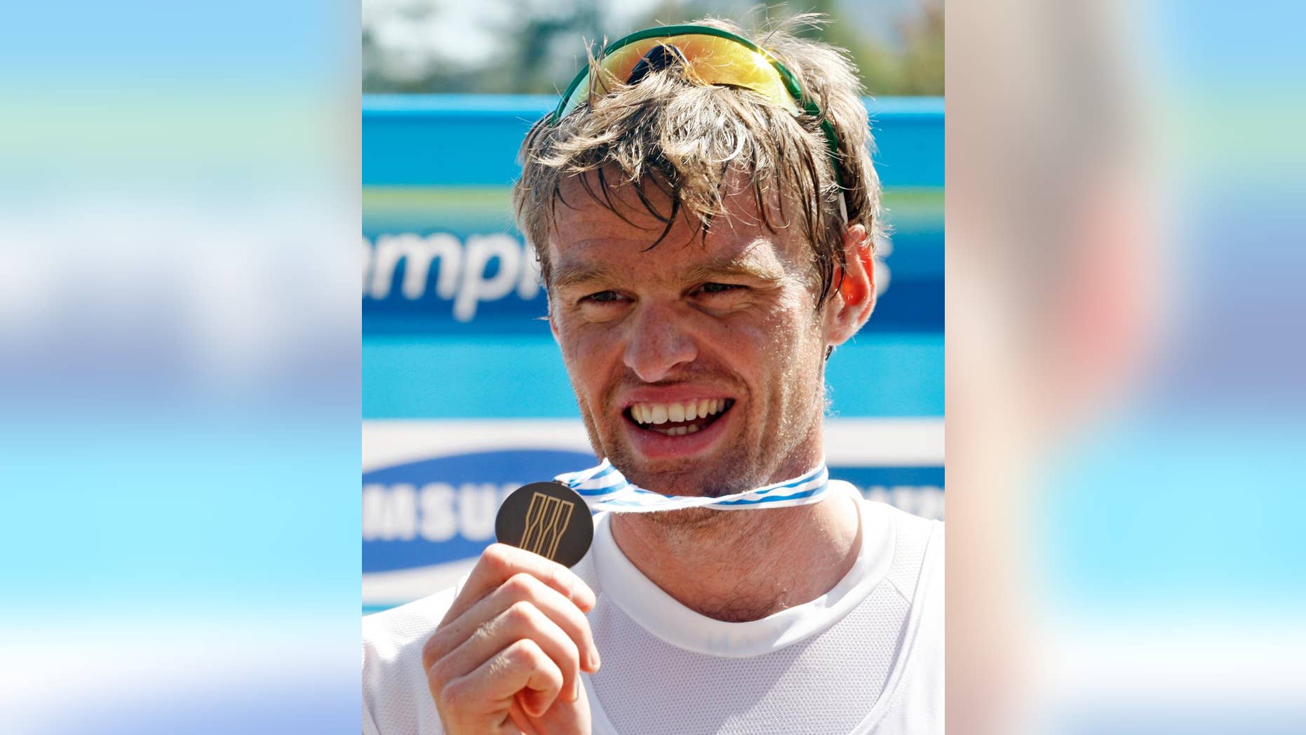 FILE - In this Saturday, Sept. 3, 2011 file photo, British rower Alan Campbell displays his bronze medal on the podium after the Men's Single Sculls Final event at the World Rowing Championships in Bled, Slovenia. An abscessed lower left wisdom tooth threatened to keep British rower Alan Campbell from the 2008 Beijing Olympics. The infection spread to his shoulder, back and eventually settled in his right knee, requiring surgery two months before the games and ruining his training. He placed fifth in the Olympic single sculls final and feels “I certainly would have gone quicker” had the infected tooth not laid him so low, keeping him out of his boat for six weeks. t the London Games four years later, Campbell won bronze. He is adamant that taking better care of his teeth has helped him row faster. He says he now flosses more, tends to drink water rather than sugary drinks, is “more aware of how important dental hygiene is to me and my body” and “if I thought I had any problems I would just have a tooth removed.” (AP Photo/Filip Horvat, File)