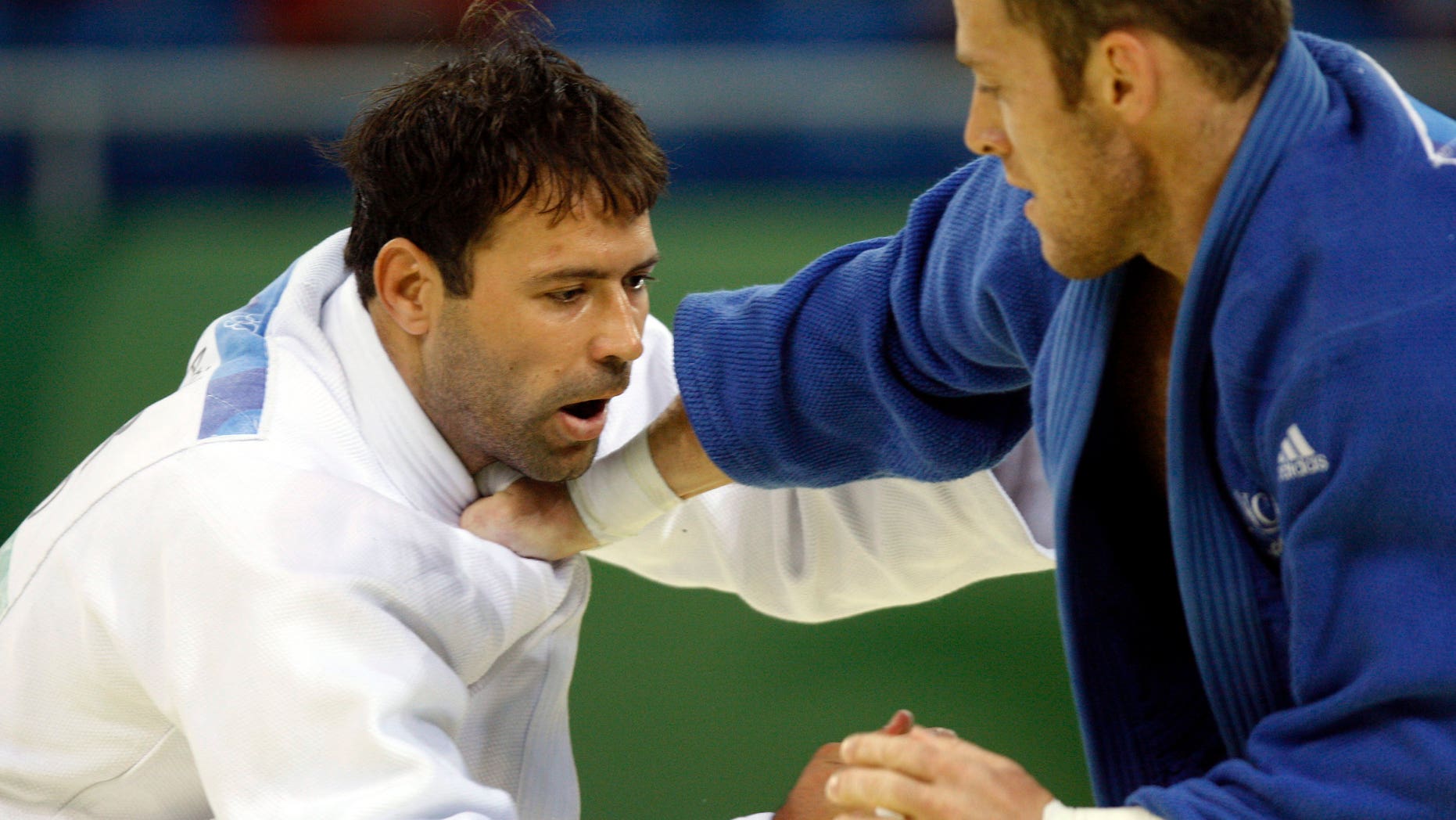 Aug. 14, 2008: Israel's Arik Zeevi, white, and France's Frederic Demontfaucon compete at the men's judo -100kg half heavyweight division preliminaries at the Beijing 2008 Olympics in Beijing.