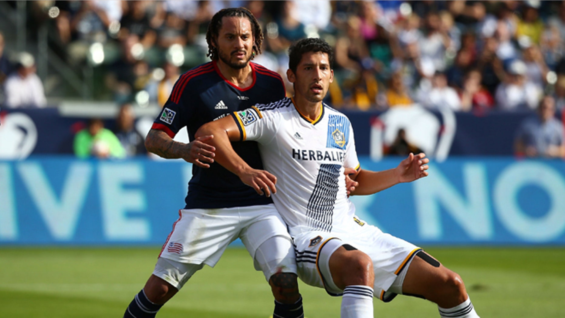 LOS ANGELES, CA - DECEMBER 07: Omar Gonzalez #4 of the Los Angeles Galaxy and Jermaine Jones #13 of the New England Revolution vie for position prior to a corner kick in the first half during 2014 MLS Cup at StubHub Center on December 7, 2014 in Los Angeles, California. The Galaxy defeated the Revolution 2-1. (Photo by Victor Decolongon/Getty Images)