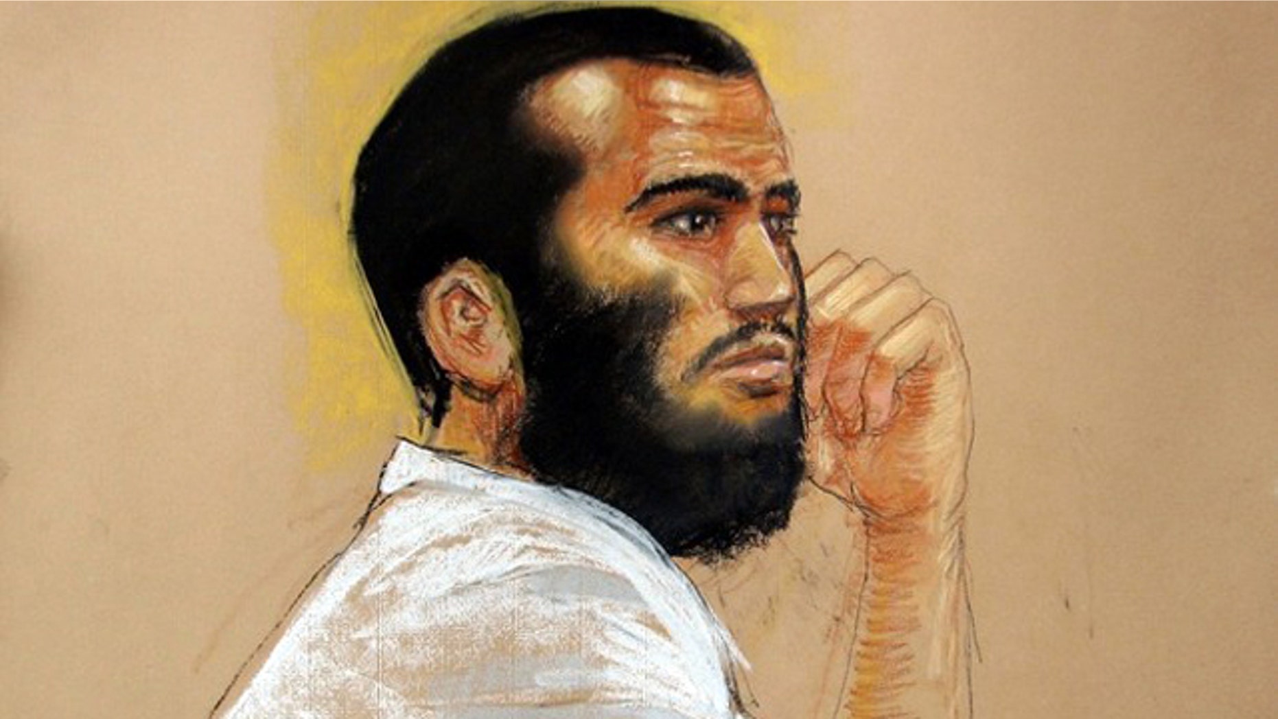 April 28, 2010: Sketch by courtroom artist Janet Hamlin shows Canadian defendant Omar Khadr attends a hearing in the courthouse for the U.S. military war crimes commission at the Camp Justice compound on Guantanamo Bay U.S. Naval Base in Cuba.