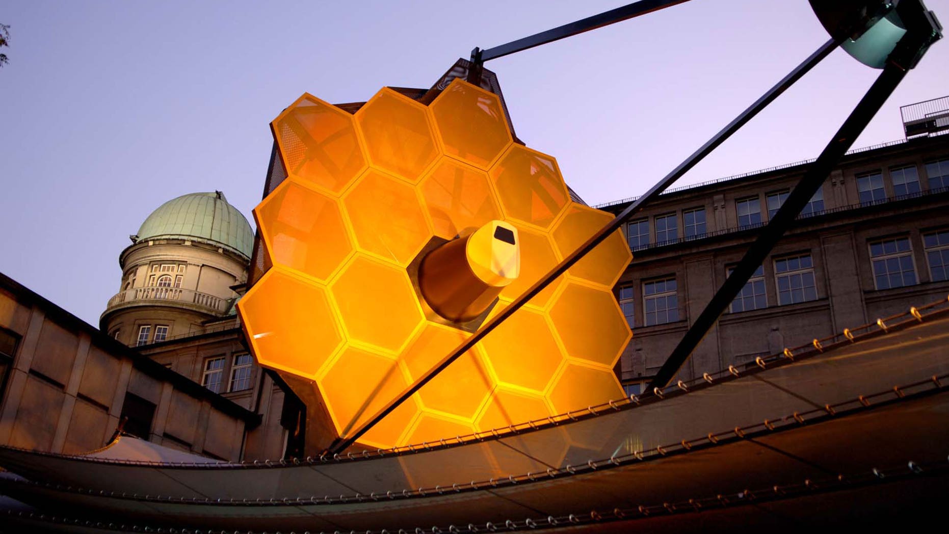 A full-scale model of the James Webb Space Telescope built by the prime contractor, Northrop Grumman, provides a better understanding of the size, scale and complexity of this satellite. The model is constructed mainly of aluminum and steel, weighs 12,000 lb., and is approximately 80 feet long, 40 feet wide and 40 feet tall. The model requires 2 trucks to ship and assembly takes a crew of 12 approximately four days.