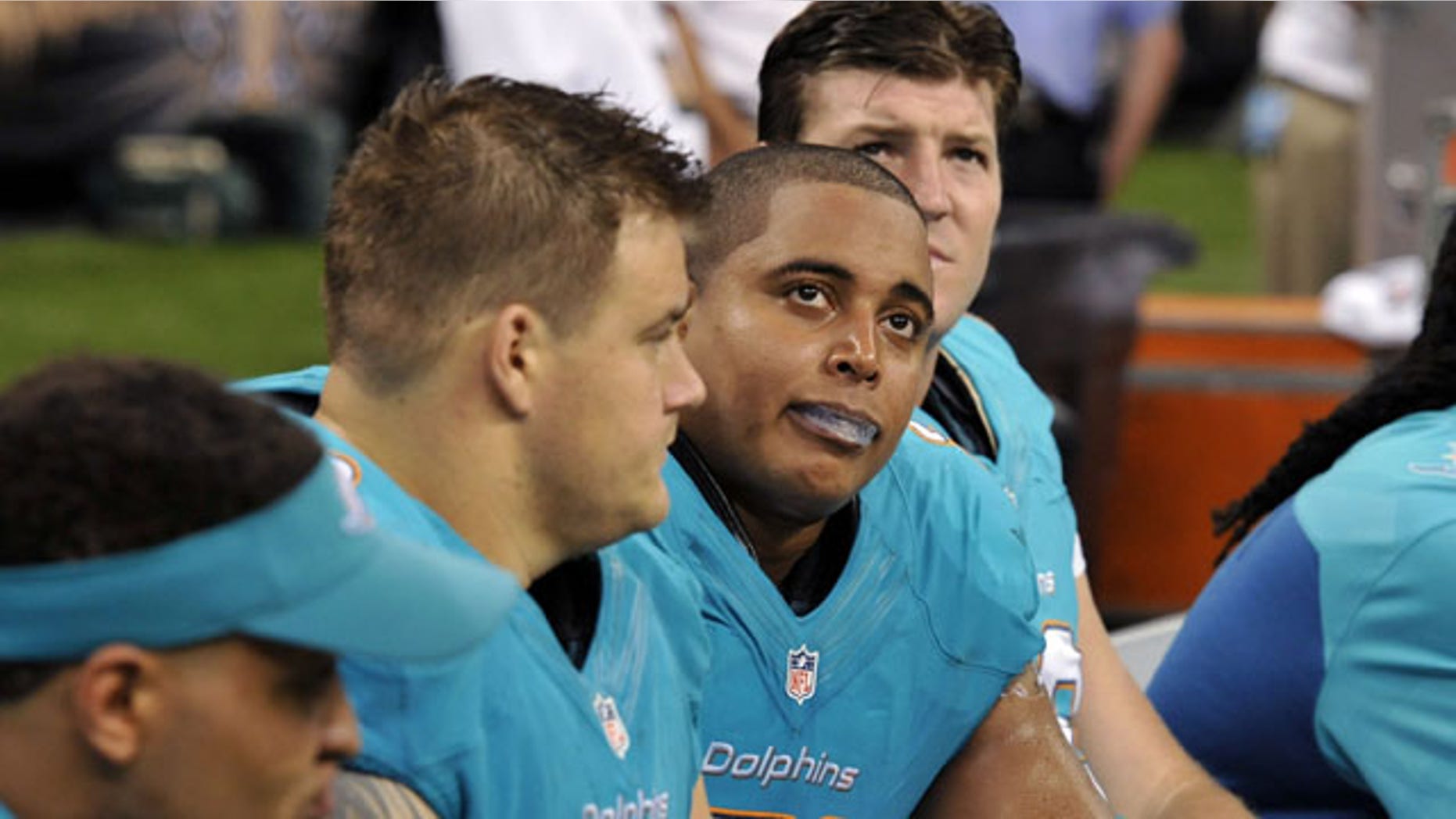 Sept. 30, 2013: Miami Dolphins guard Richie Incognito (68), center left, and tackle Jonathan Martin (71), center right, sit on the bench in the second half of an NFL football game against the New Orleans Saints in New Orleans. (AP)