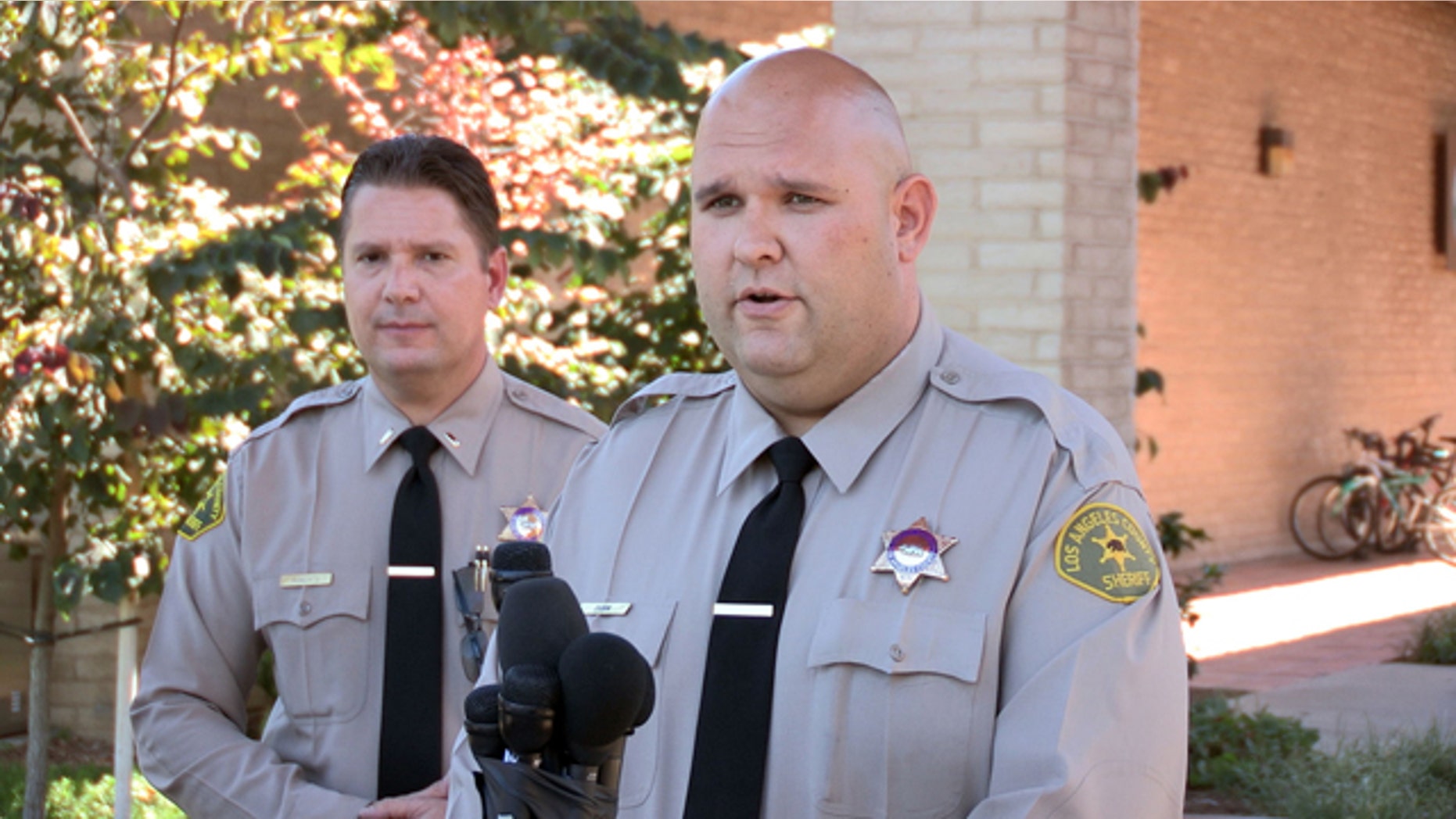 August 17, 2014: Santa Clarita Valley Sheriffs Station deputy Joshua Dubin announces the arrest of a 15-year-old boy on suspicion of posting online threats to shoot students at schools in Valencia, Calif. (AP Photo/The Santa Clarita Valley Signal, Austin Dave)