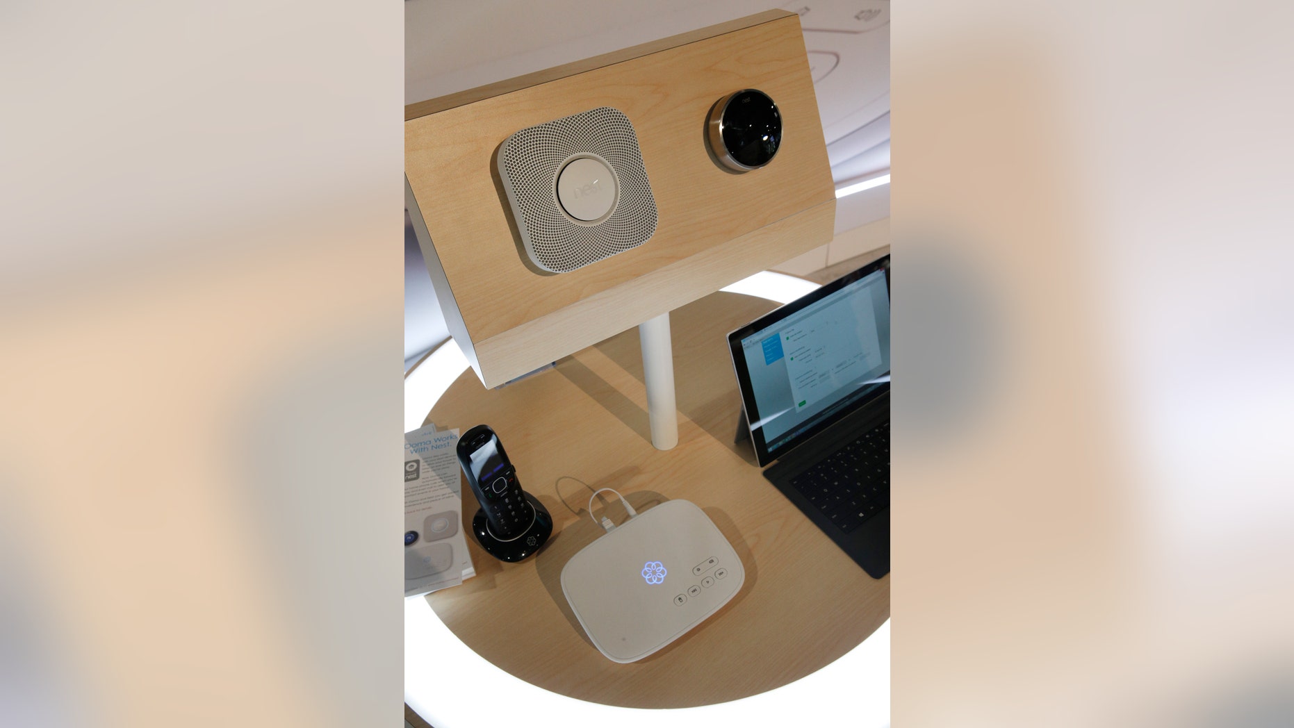 An Ooma Telo, center on bottom, is on display with nest devices, top, at the Ooma during the International CES Thursday, Jan. 8, 2015, in Las Vegas.