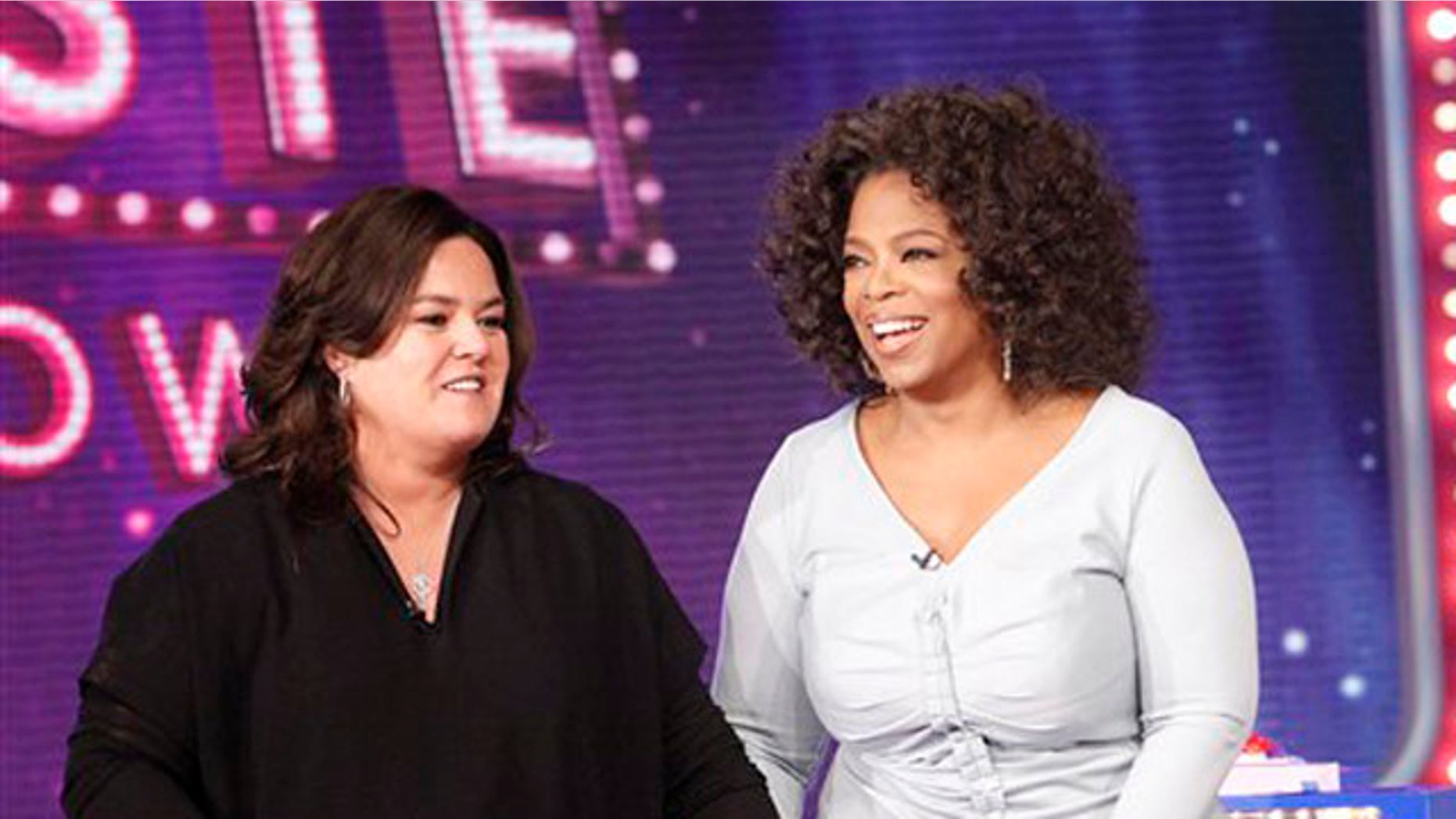 Oct. 10, 2011: In this file image released by Harpo, Inc., Oprah Winfrey, right, is shown with host Rosie O'Donnell during the debut of "The Rosie Show" in Chicago.
