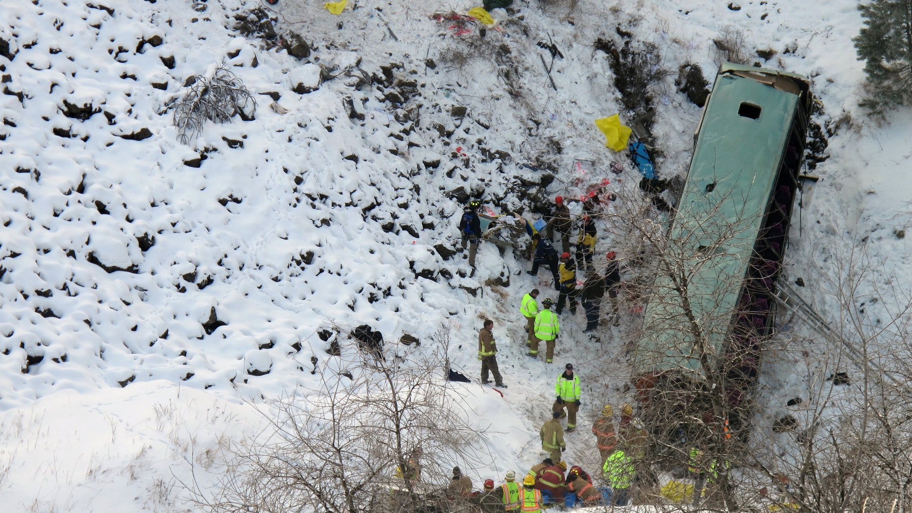 Dec. 30, 2012: Emergency personnel respond to the scene of a multiple fatality accident where a tour bus careened through a guardrail along an icy Oregon highway and fell several hundred feet down a steep embankment.